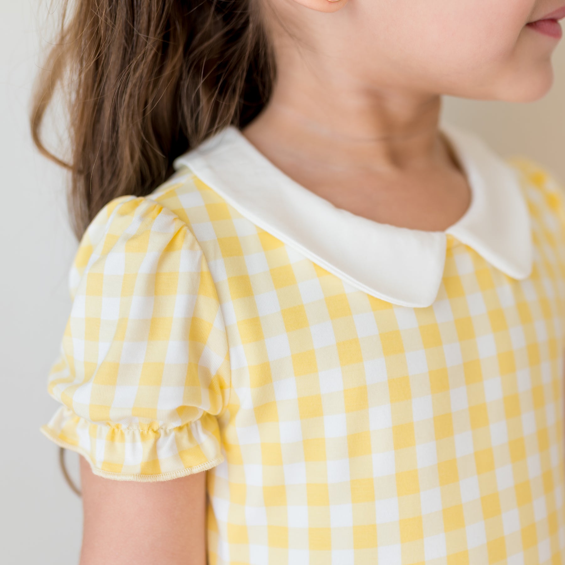 Close up of the flutter sleeve and white collar on the Peter Pan Collar Dress in Gingham Chamomile