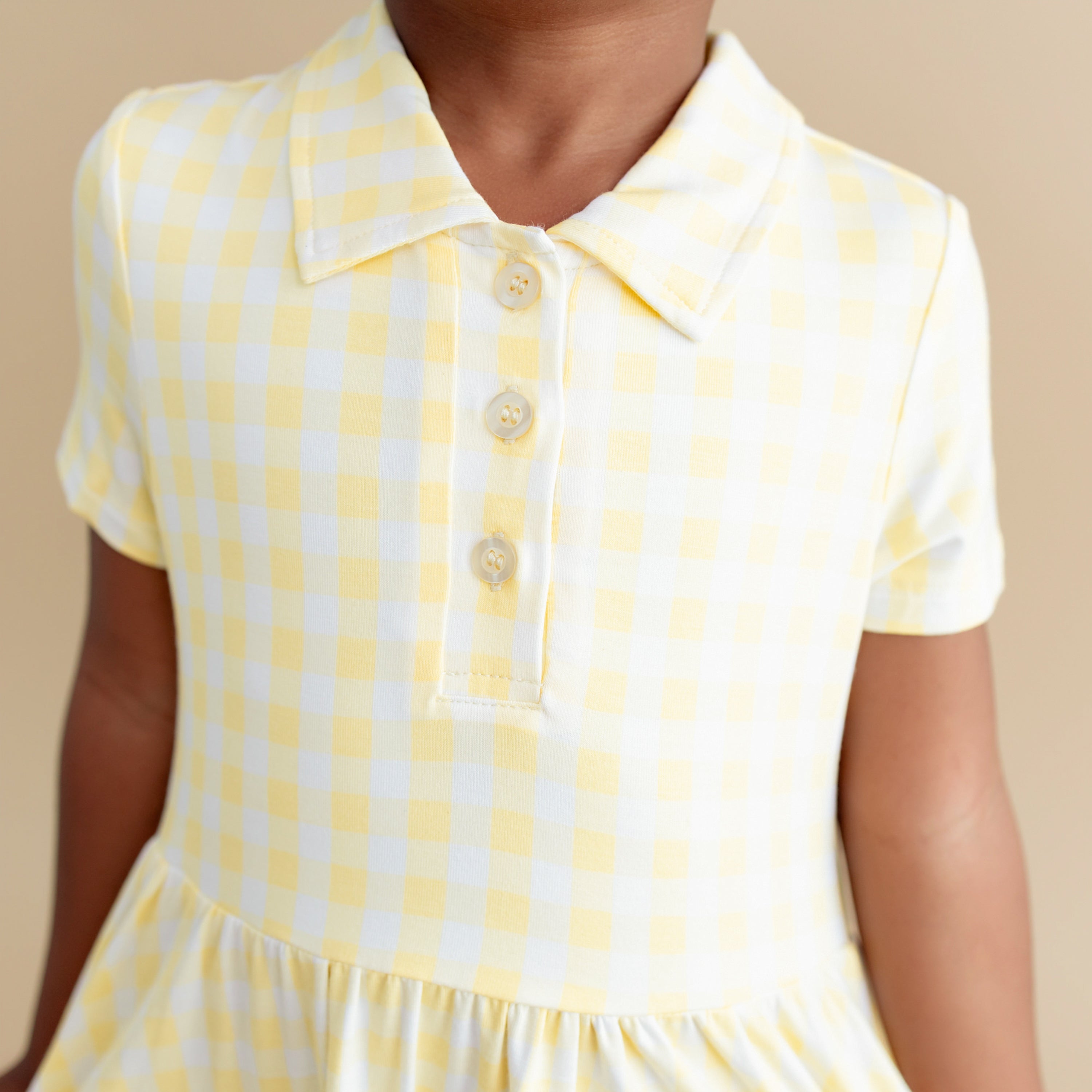 Close up of the collar and button placket of the Polo Dress in Gingham Chamomile