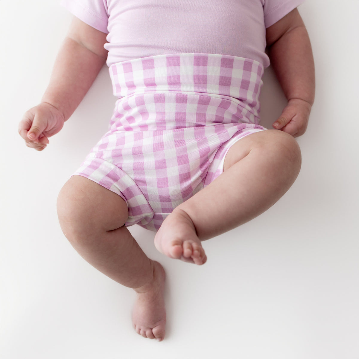 Close up of the Bummies in Gingham Thistle shown on an infant