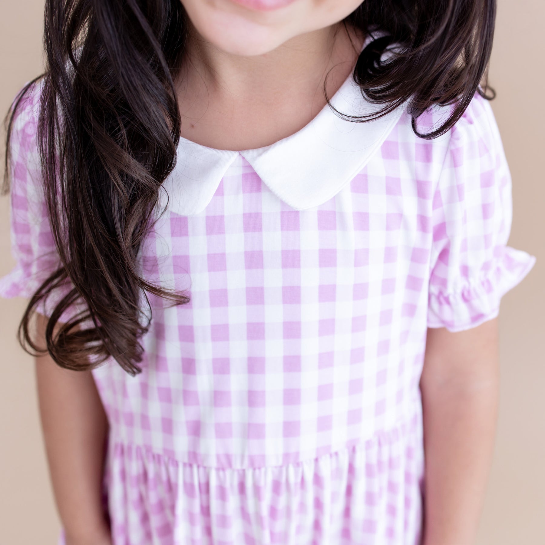 Close up of the white collar and puff sleeves on the Peter Pan Collar Dress in Gingham Thistle