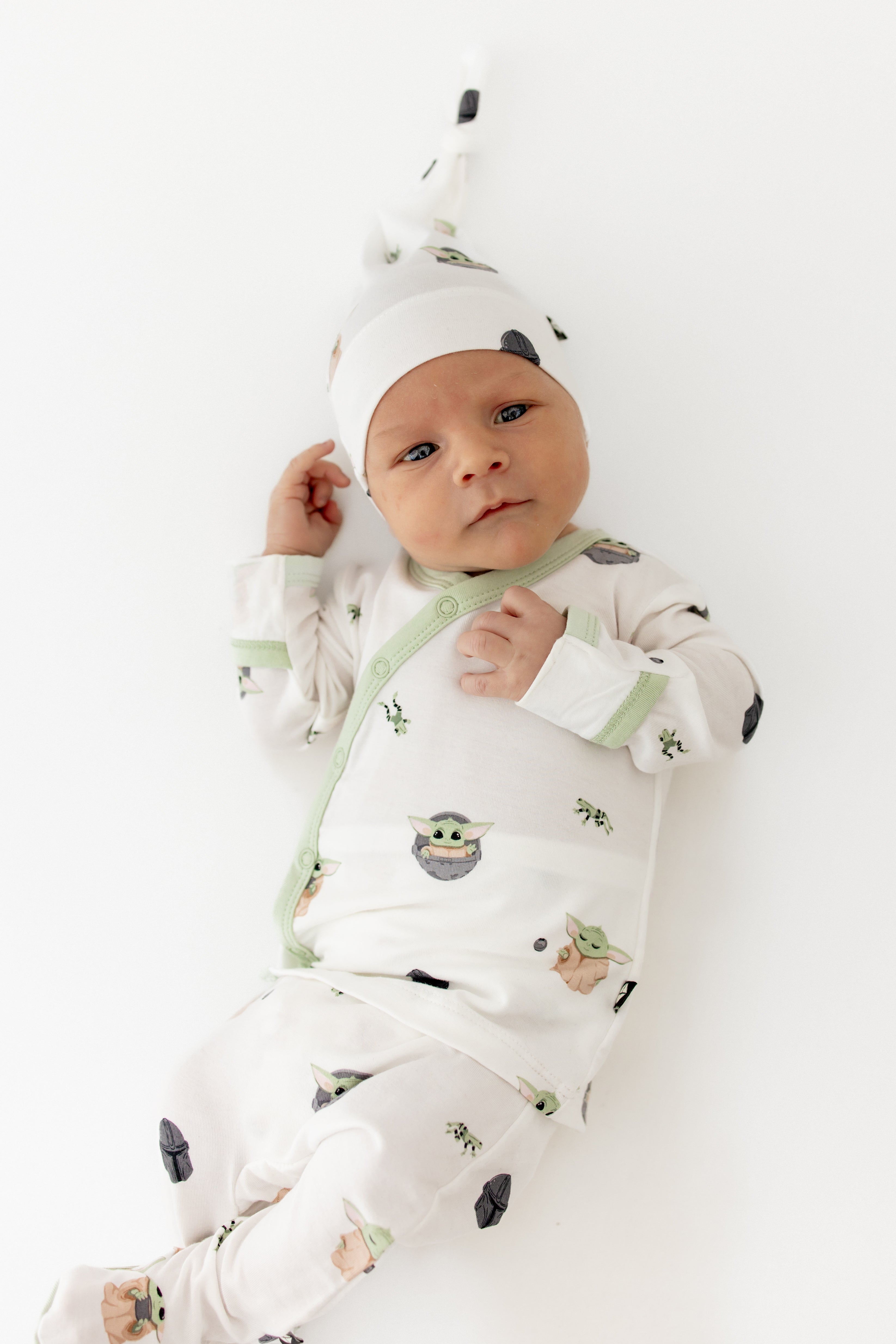 Close up of newborn wearing the Take Me Home Set with Cap in Grogu™