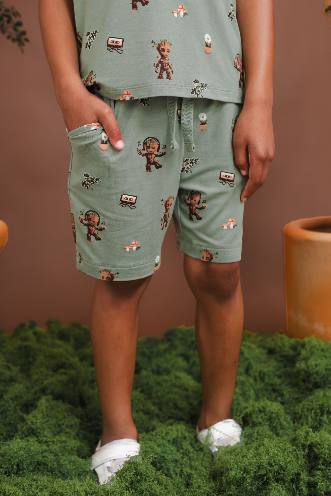 Toddler wearing Green Drawstring Short in Groot print under a similar print Toddler Basic Tee