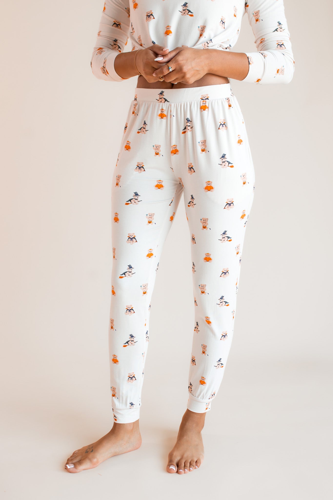 Modal showcasing jogger pajama of Women's Jogger Pajama Set in Halloween Teddy print on a beige background