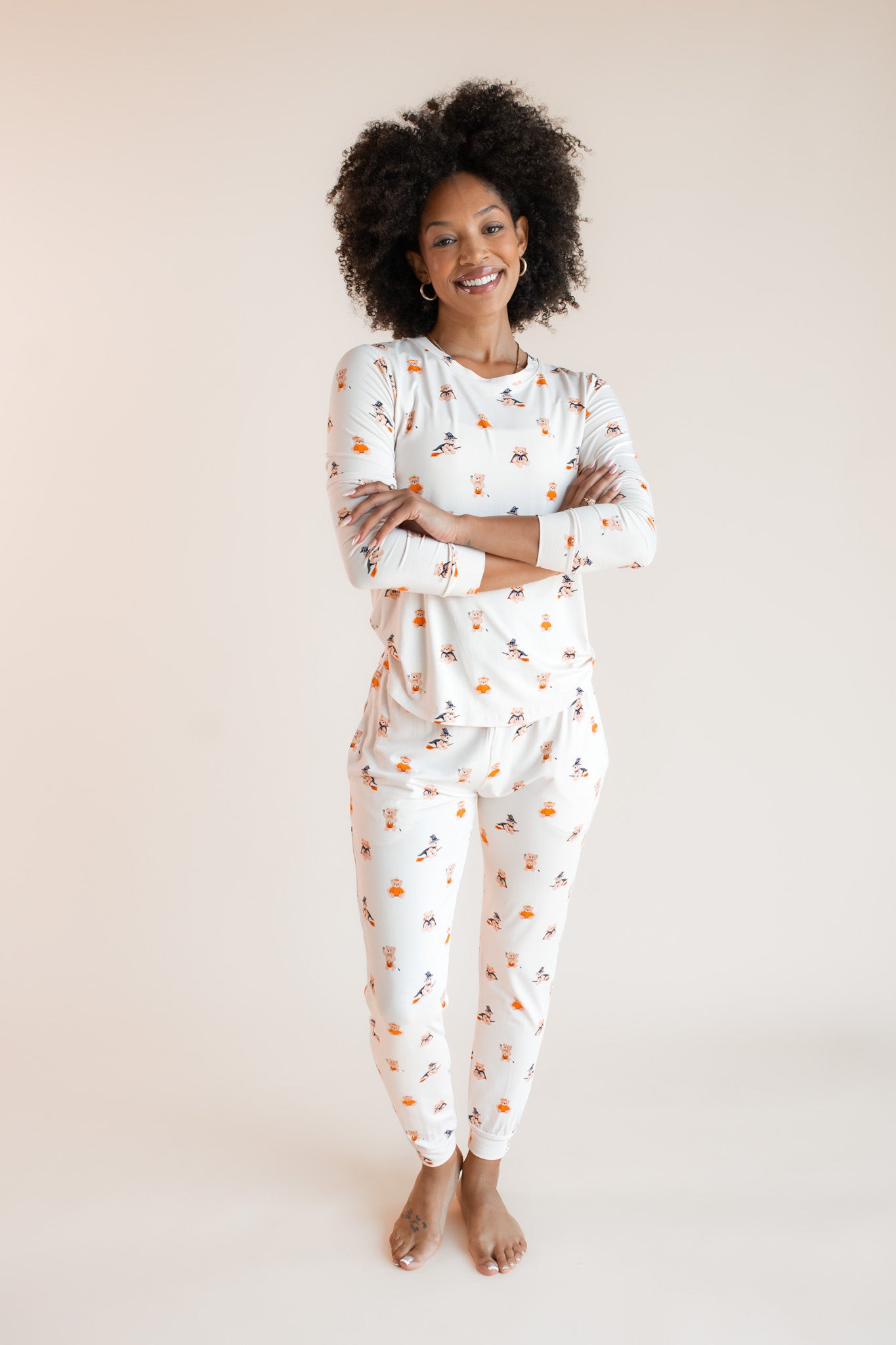 Modal wearing Women's Jogger Pajama Set in Halloween Teddy print on a beige background