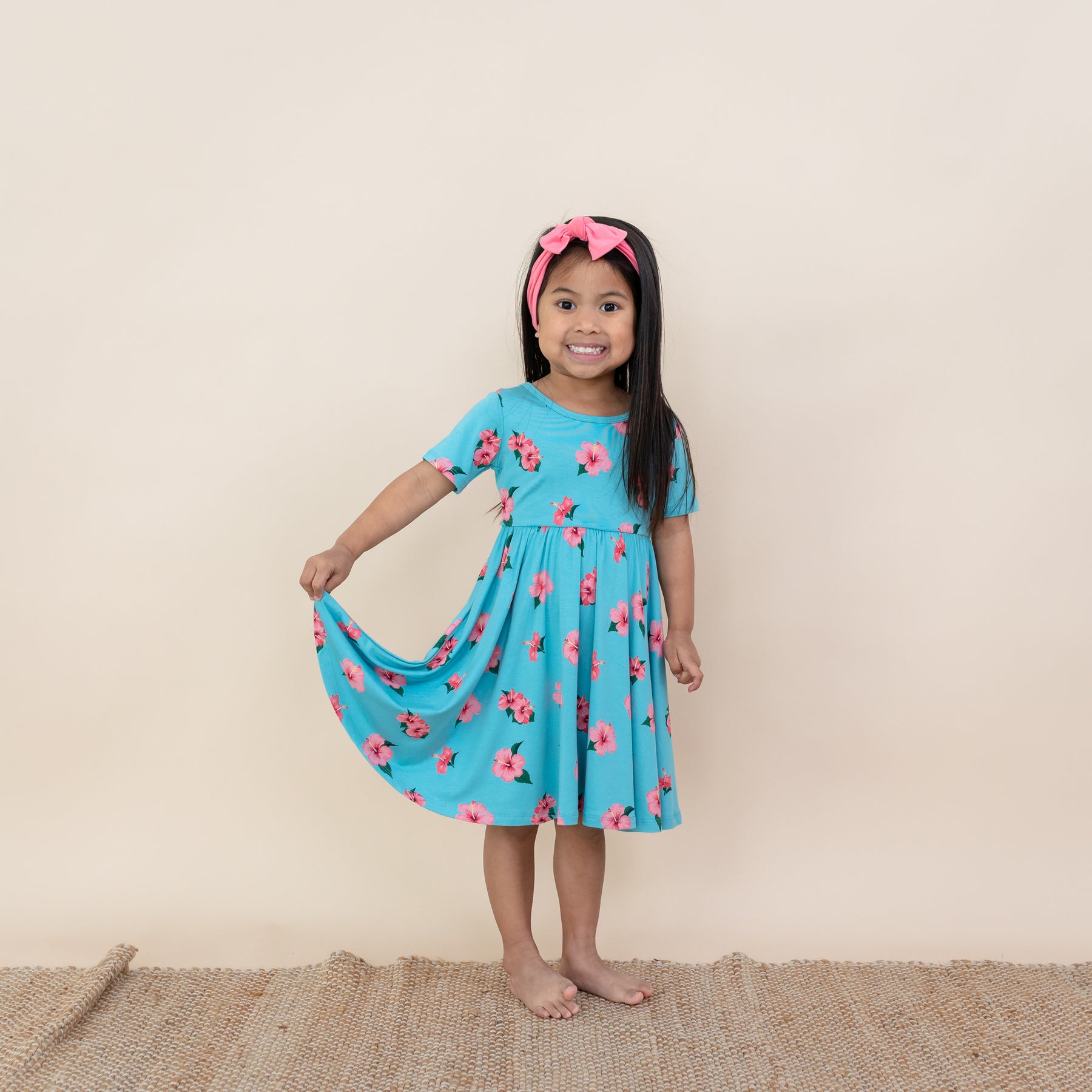 Toddler modeling Kyte Twirl Dress in Hibiscus