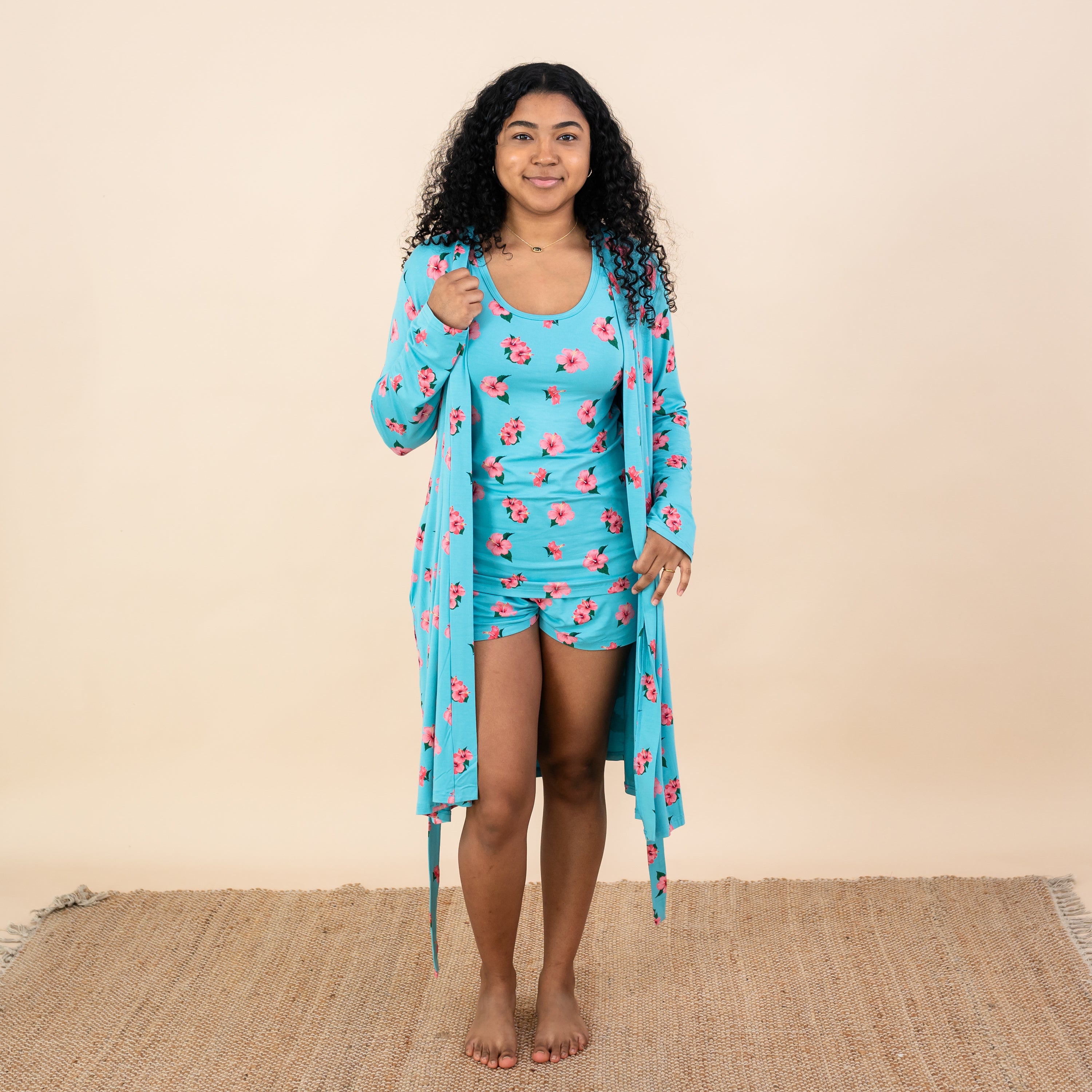 Woman modeling Kyte Tank Set and Lounge Robe in Hibiscus shown untied