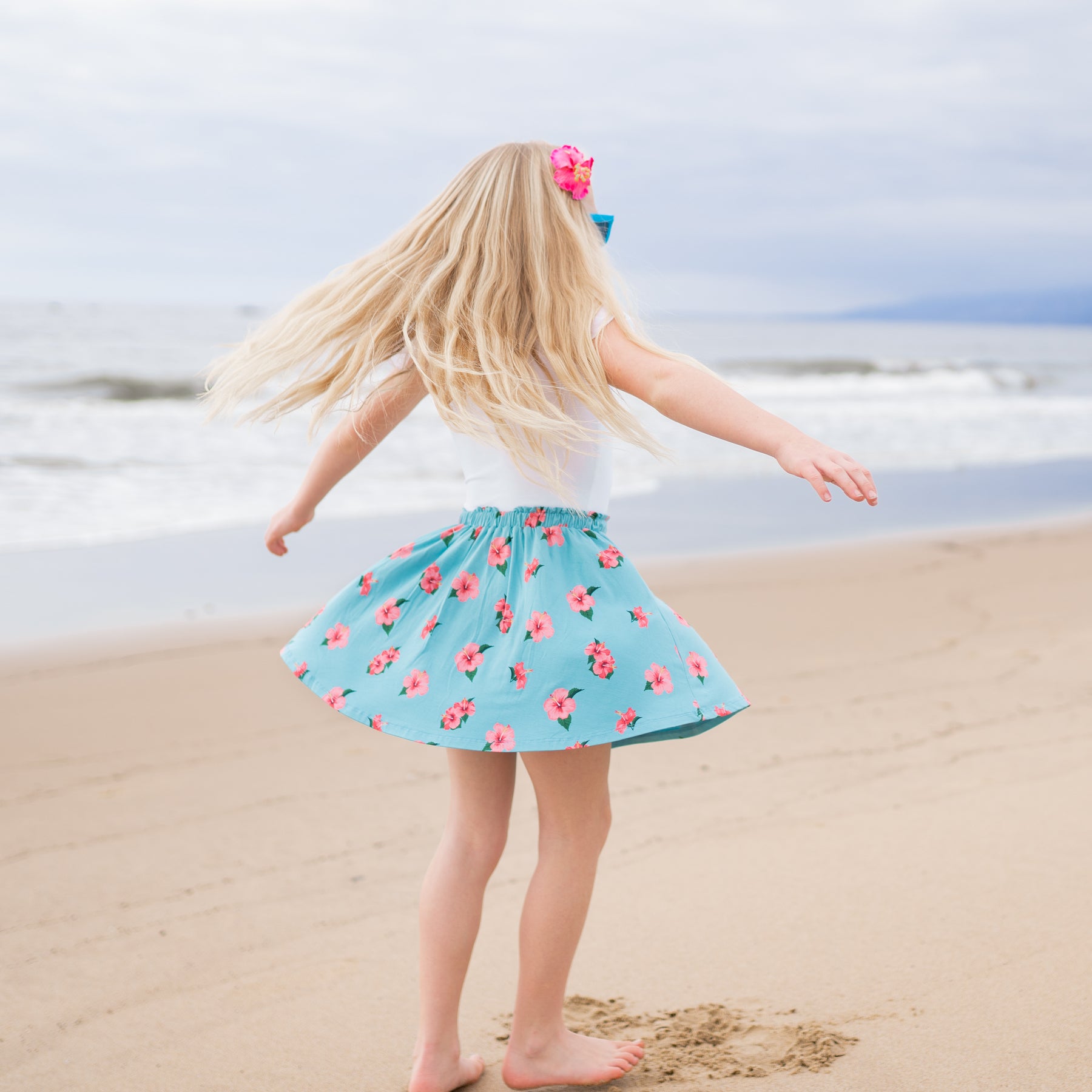 child twirling is skort in hibiscus 