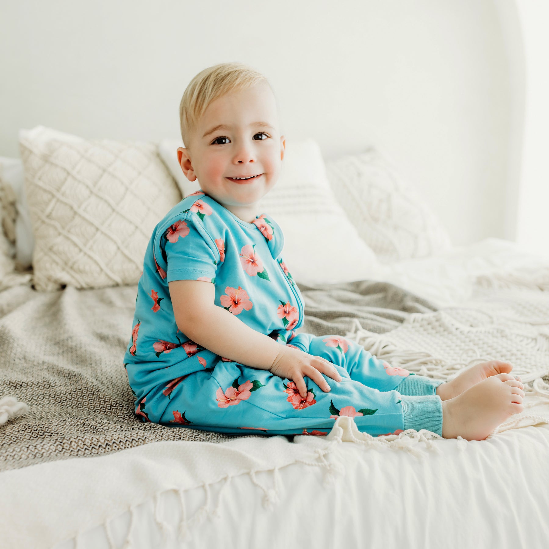 toddler wearing hibiscus sleep bag walker