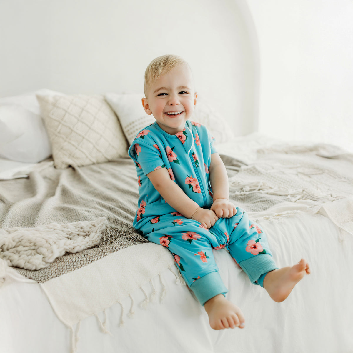 toddler wearing hibiscus sleep bag walker