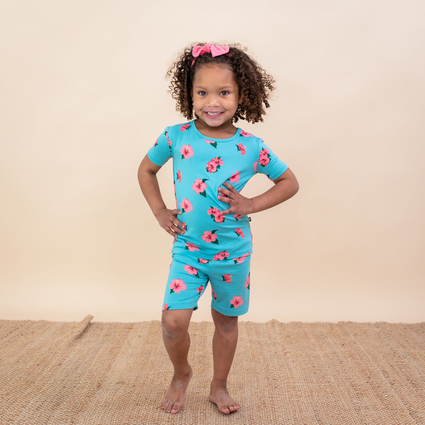 Toddler modeling Short Sleeve Pajamas in Hibiscus