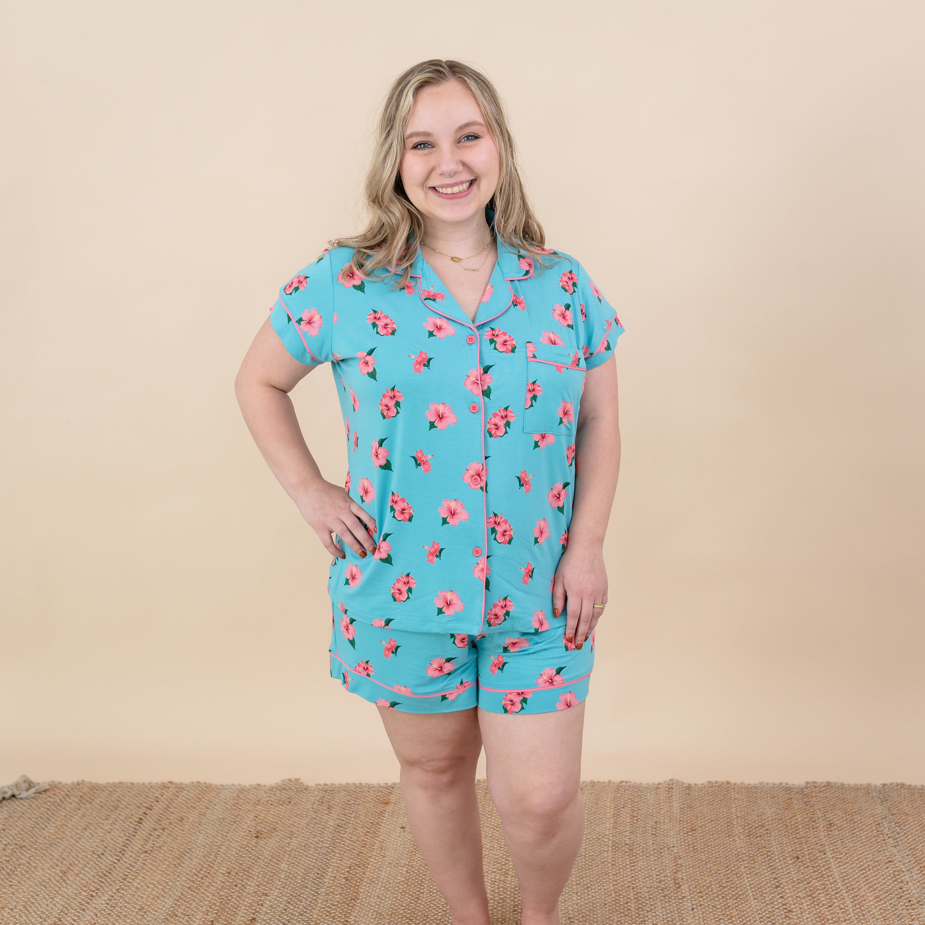 Woman modeling Kyte Short Sleeve Pajama Set in Hibiscus