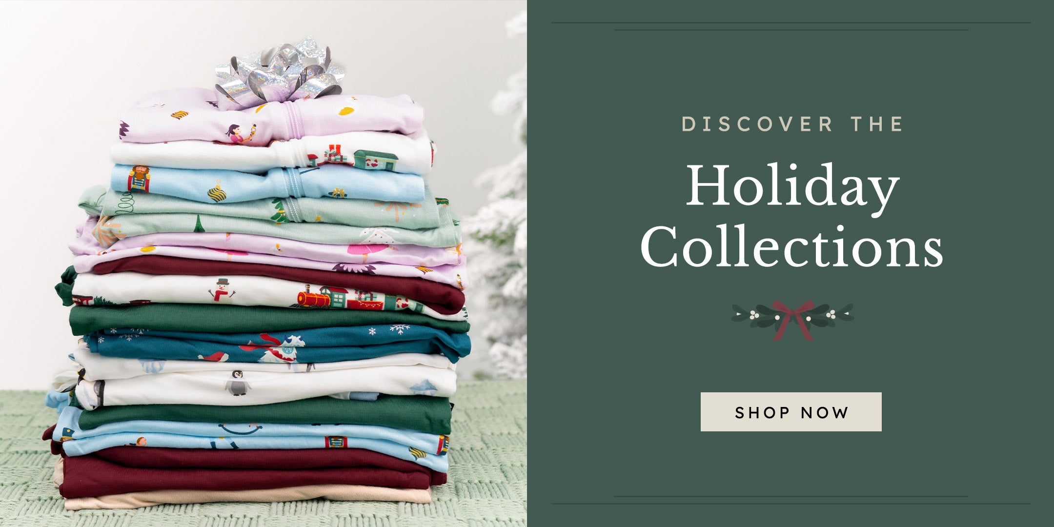 graphic that says "Discover the Holiday Collections Shop Now" featuring a stack of rompers in holiday prints 