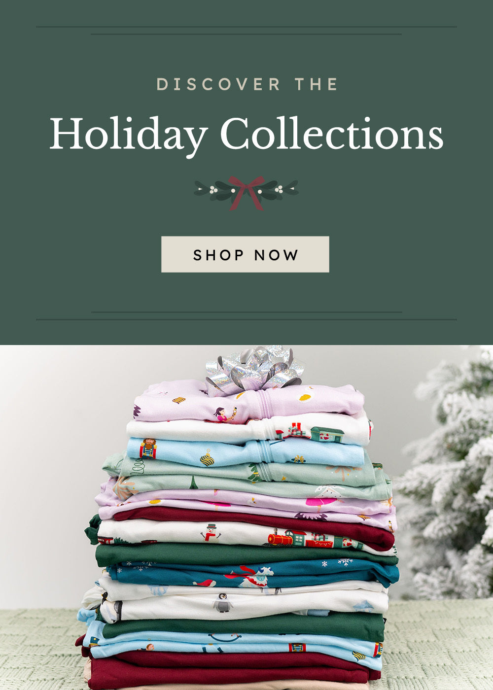 graphic that says "Discover the Holiday Collections Shop Now" featuring a stack of rompers in holiday prints 