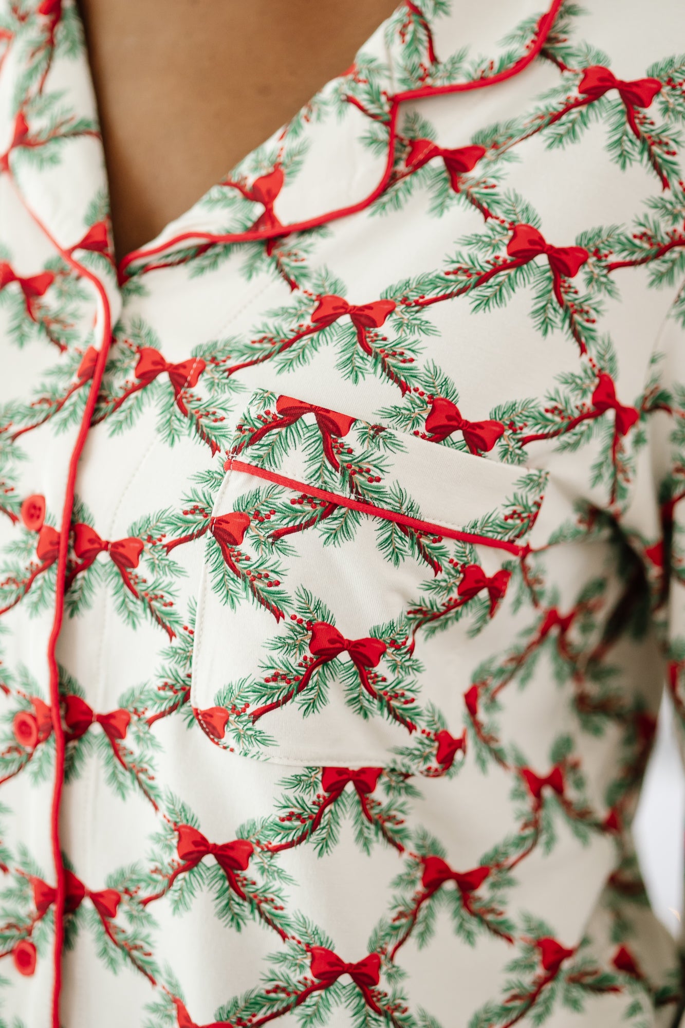Close up of the chest pocket detail of the Long-Sleeved Women's Pajama Set in Holiday Bow