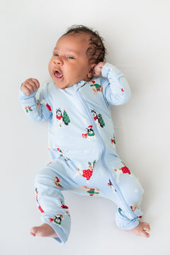 Baby wearing Zippered Romper in Holiday Pups print on a white background