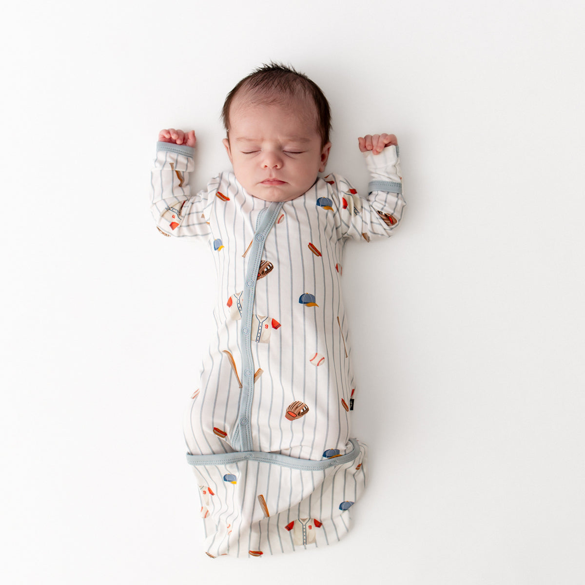 Sleeping infant wearing the Bundler in Home Run