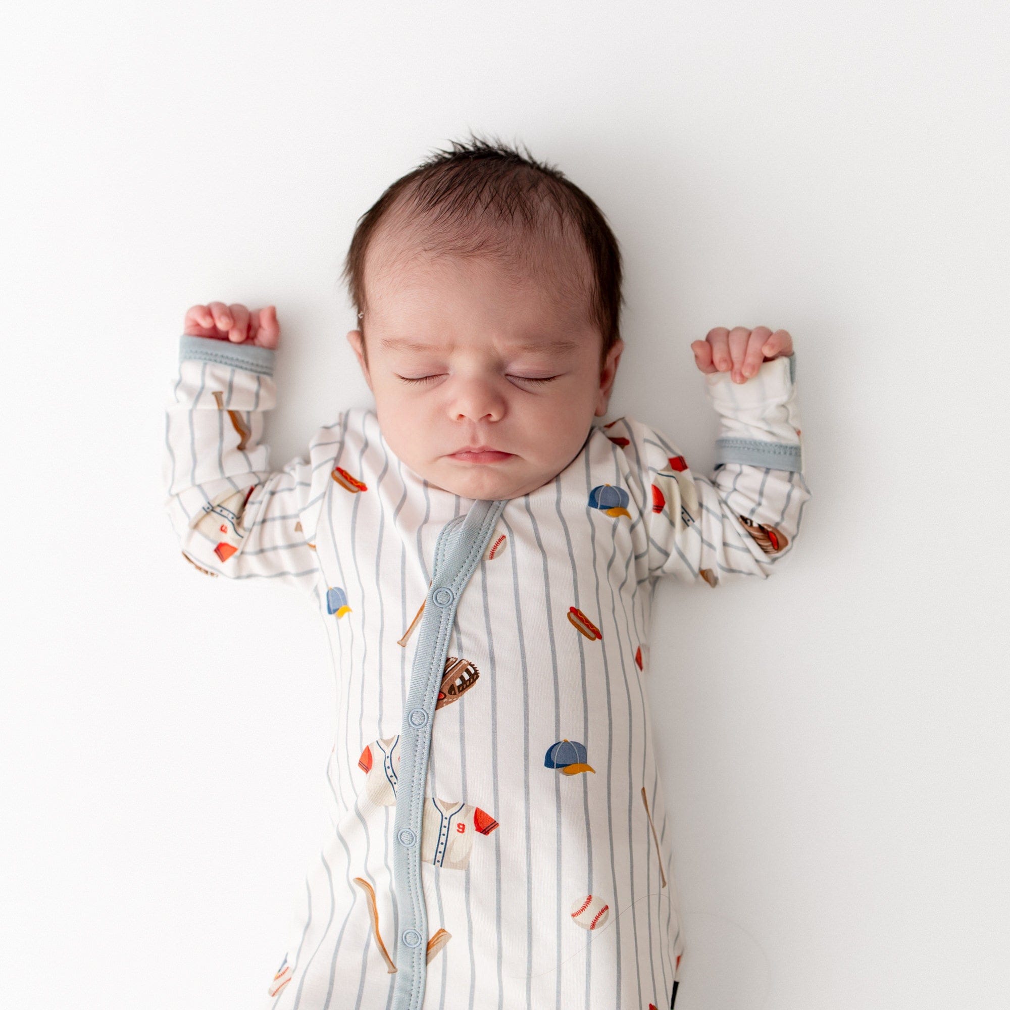 Close up of sleeping infant wearing the Bundler in Home Run