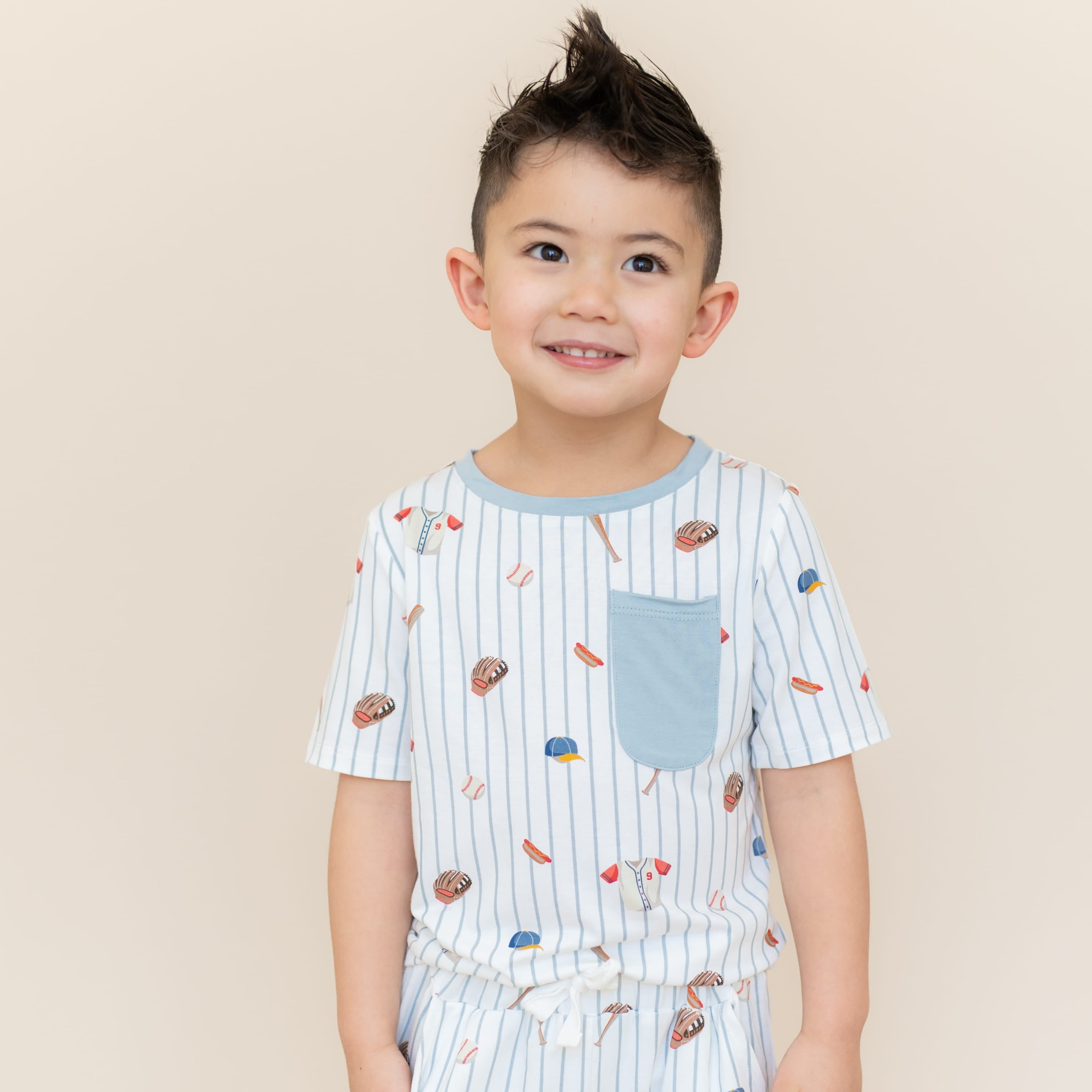Close up of the Toddler Crew Neck Tee in Home Run shown on a young boy