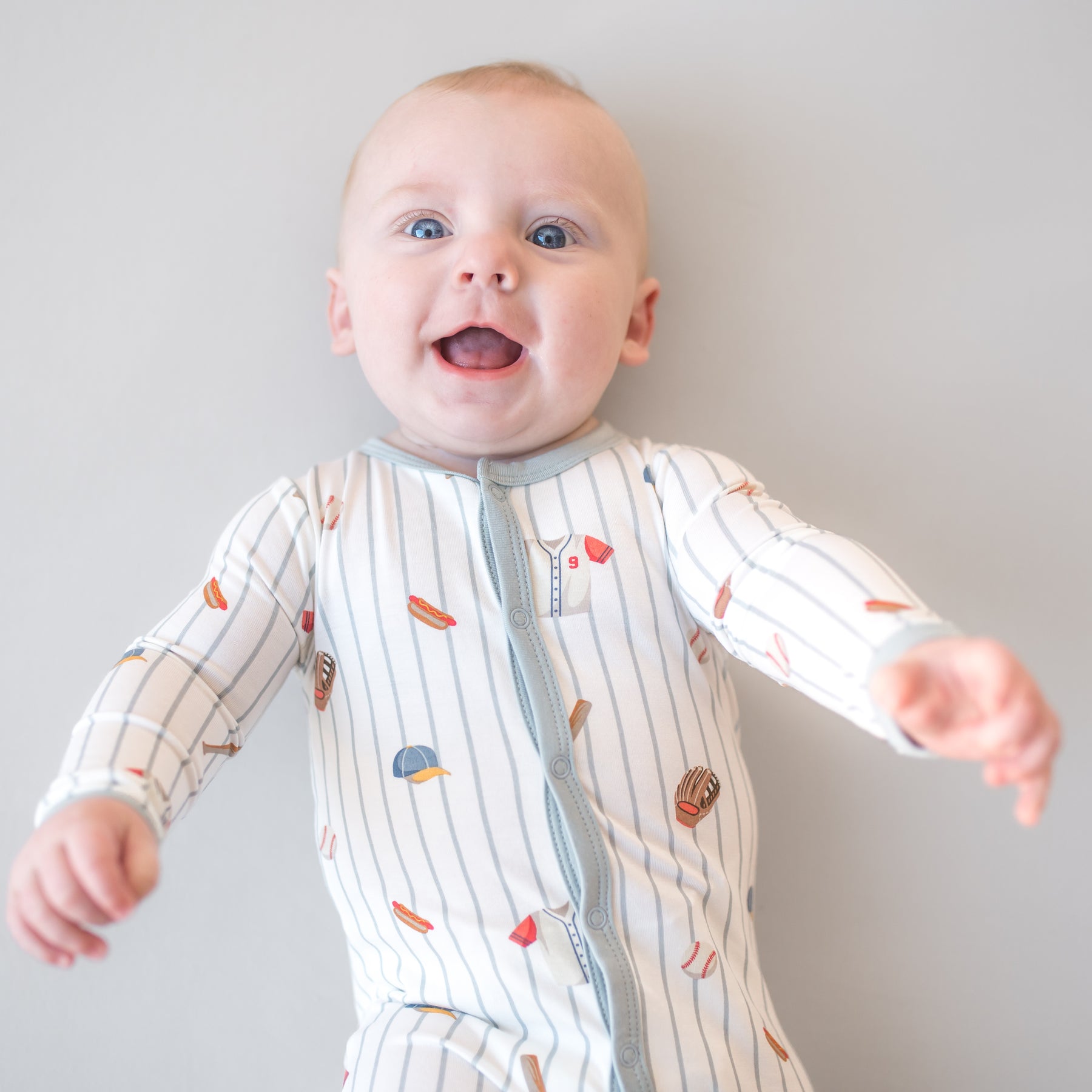 Close up of infant wearing the Footie in Home Run 