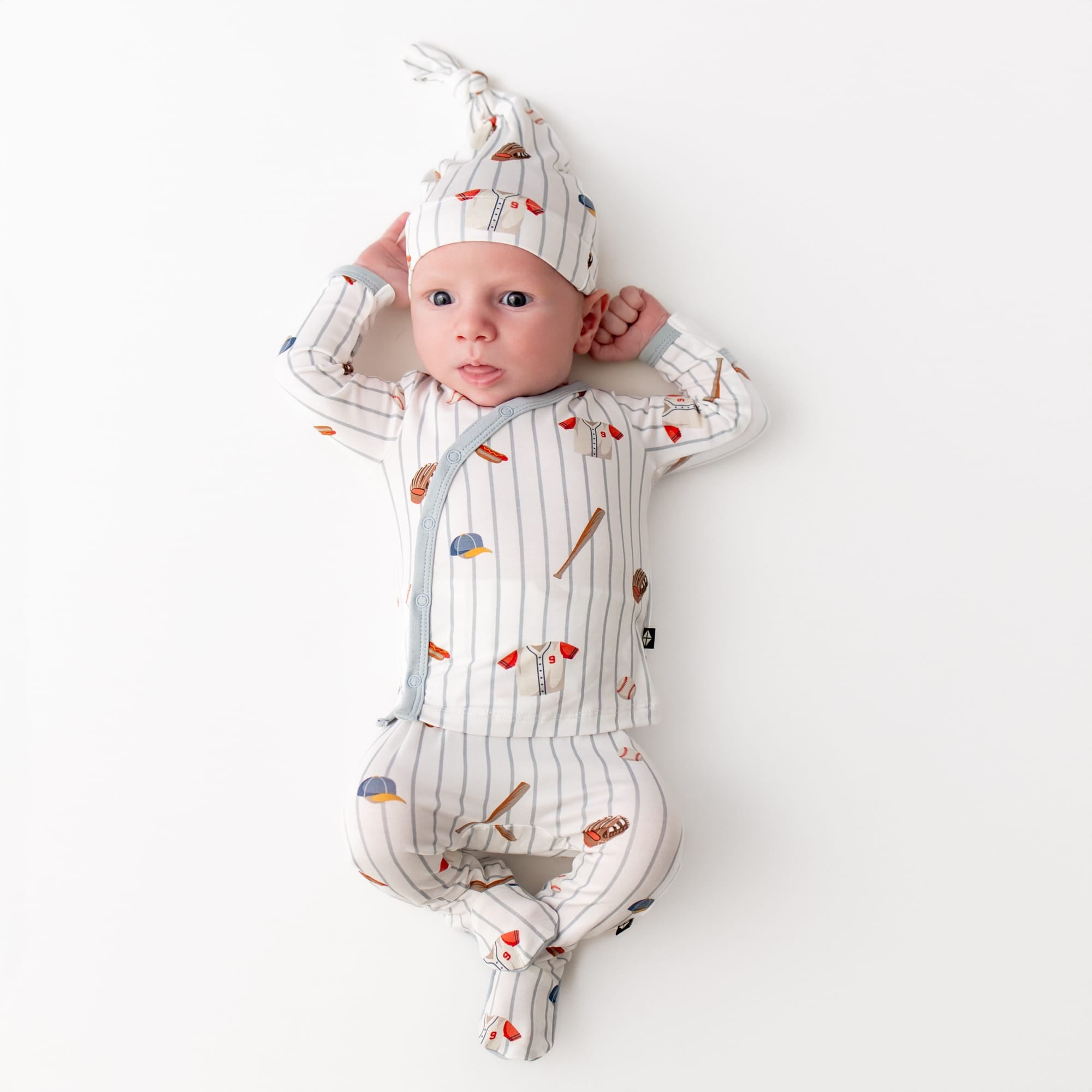 Newborn wearing the Take Me Home Set with Cap in Home Run
