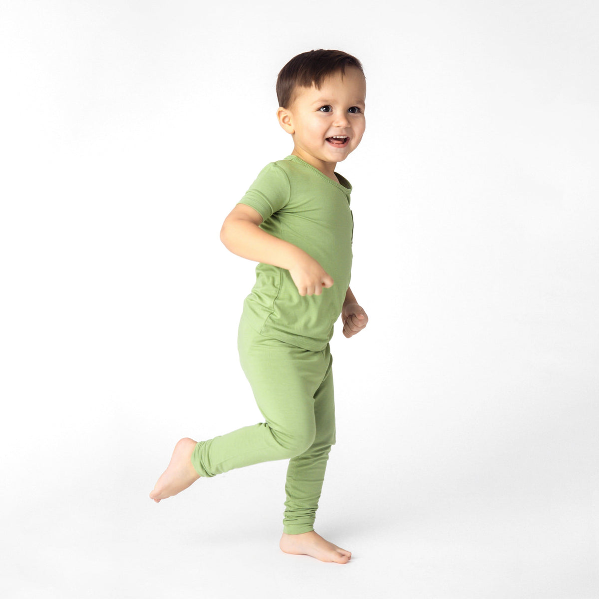 toddler modeling short sleeve with pants pajamas in honu