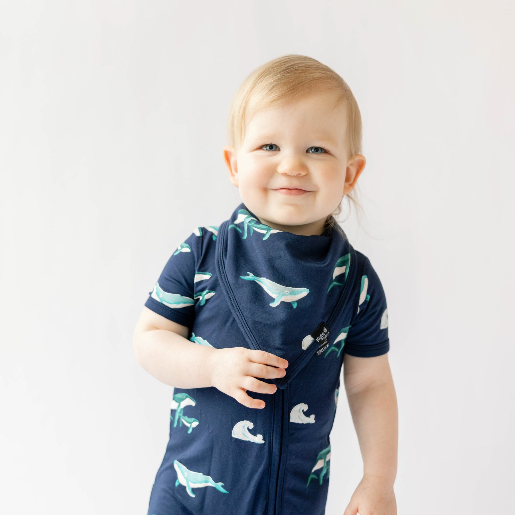 toddler modeling humpback bib