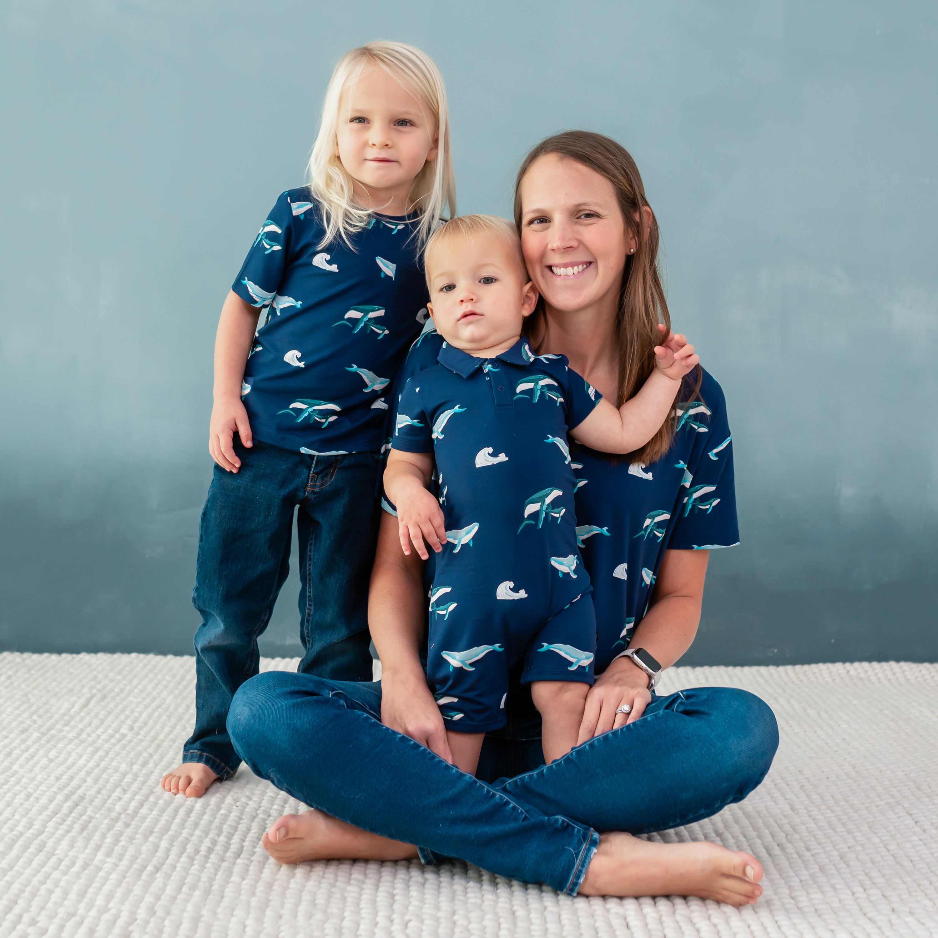 Family wearing matching Kyte apparel in Humpback print