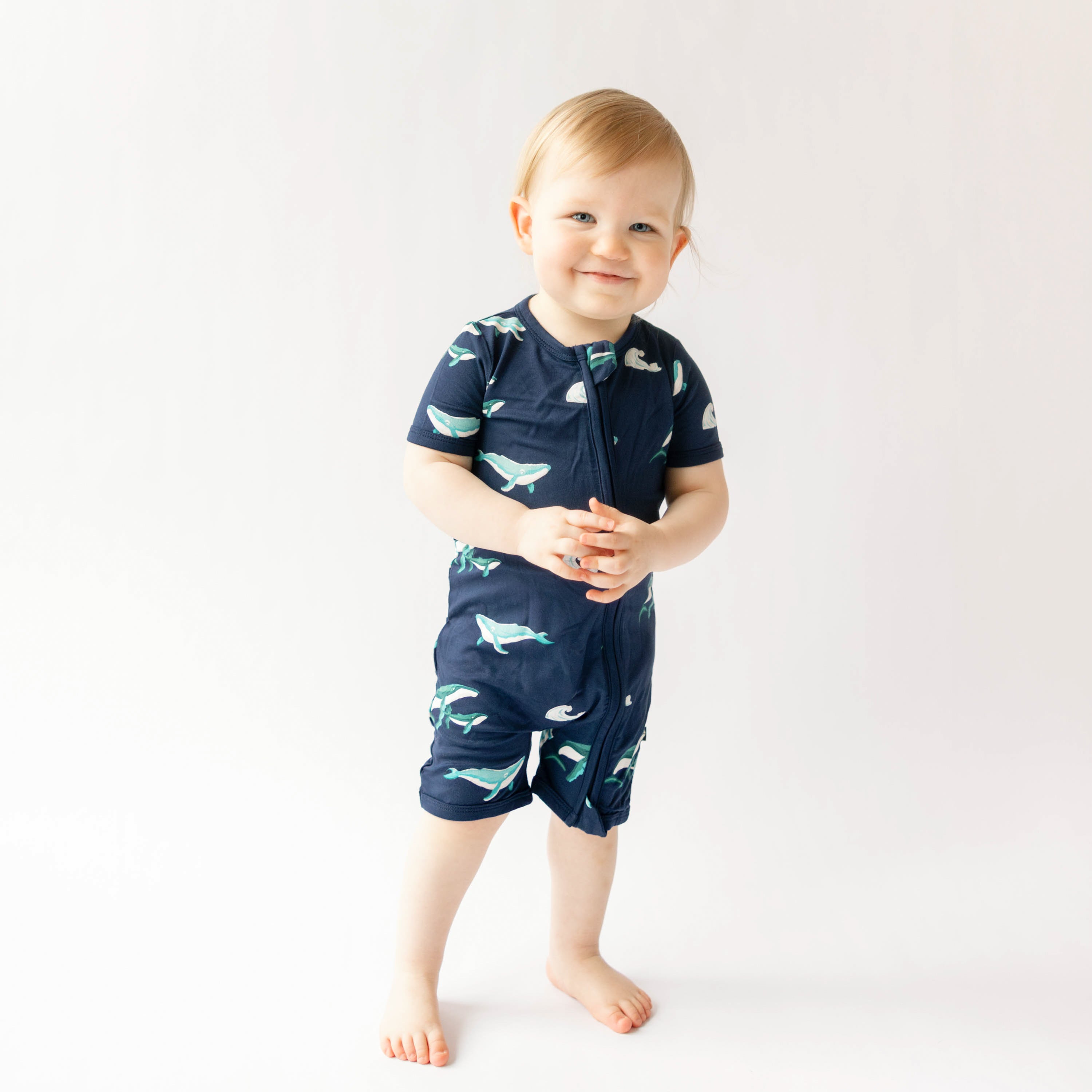 toddler wearing zippered shortall romper in humpback