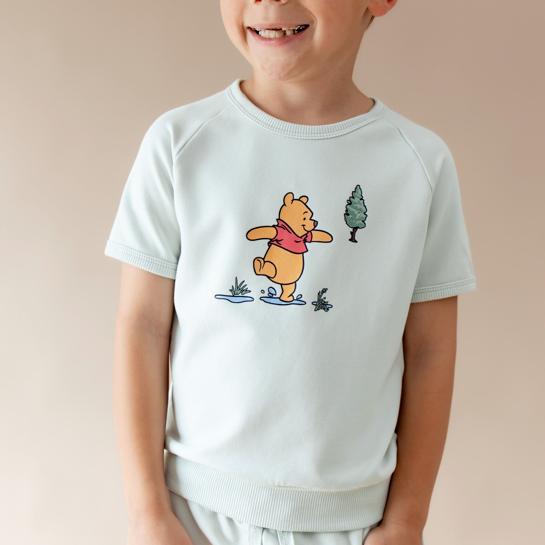 Close up of the shirt showing the winnie the pooh character on the Short Sleeve Jogger Set in Winnie the Pooh on Dew