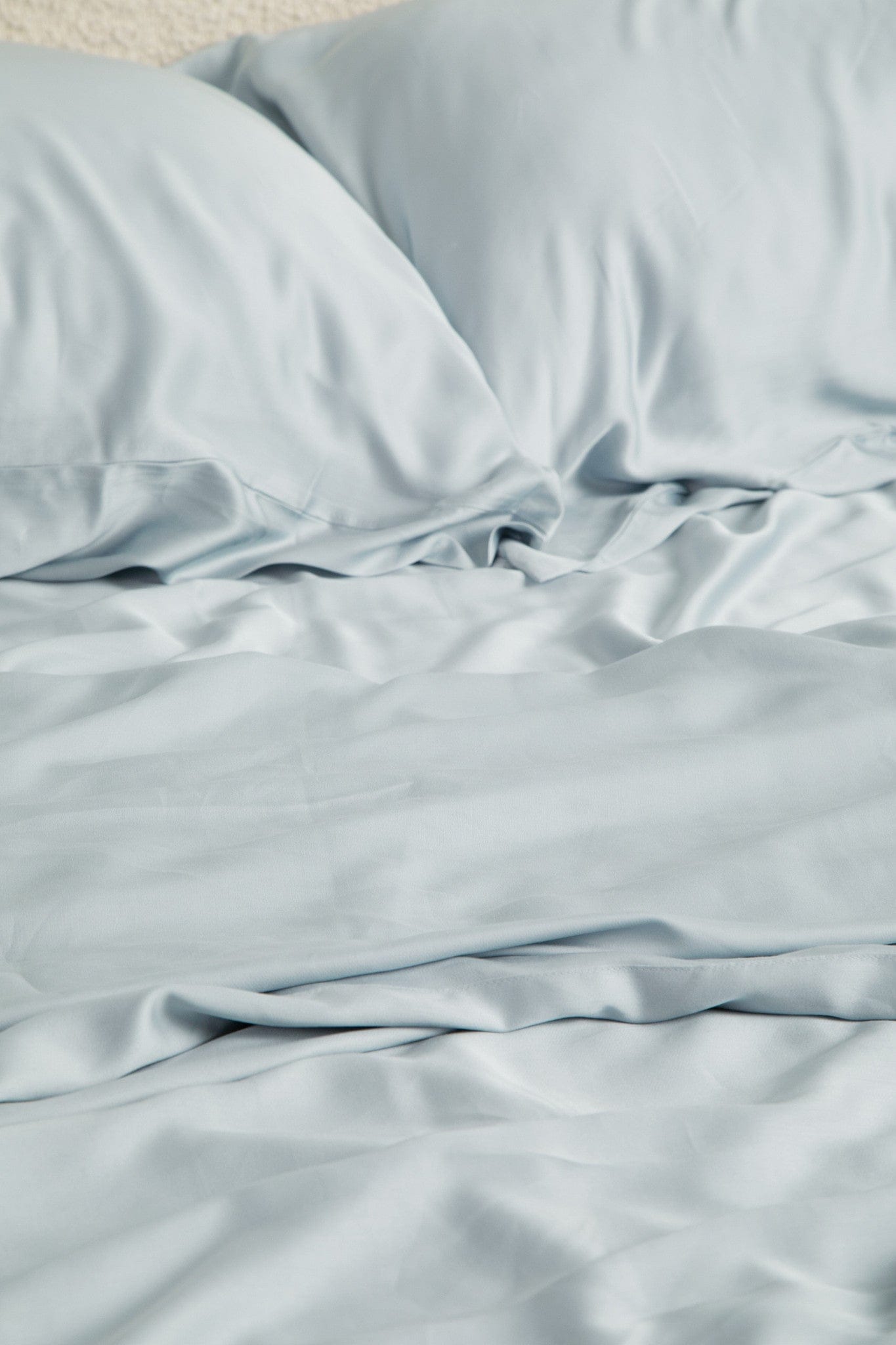 Close up of the Bamboo Sateen Sheet Set in Ice shown on a bed