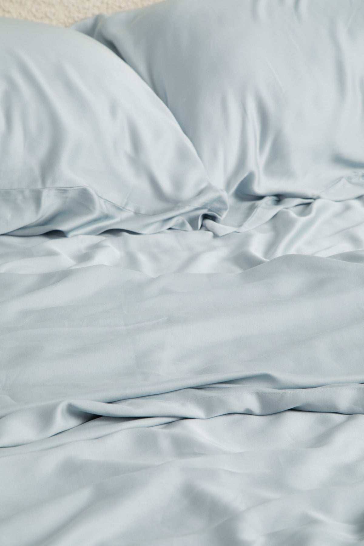 Close up of the Bamboo Sateen Sheet Set in Ice shown on a bed