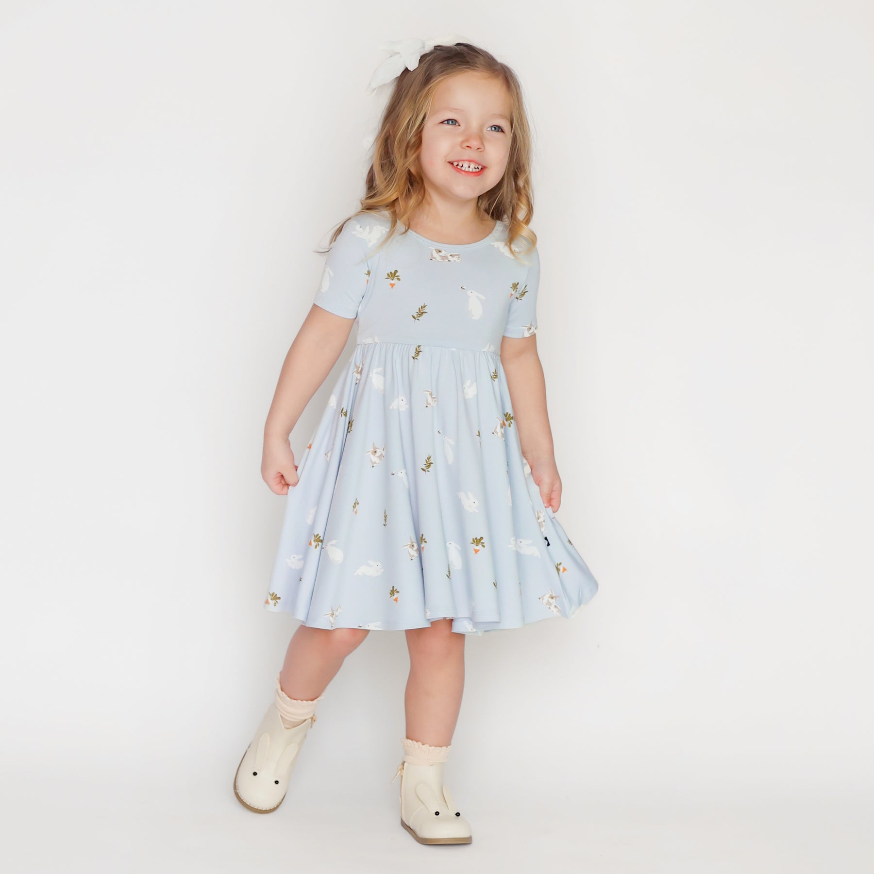 Child modeling Twirl Dress in Ice Rabbit