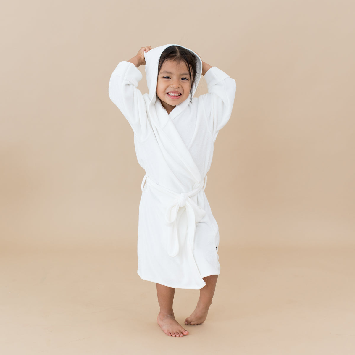 Child wearing Plush Hooded Bath Robe in Cloud white