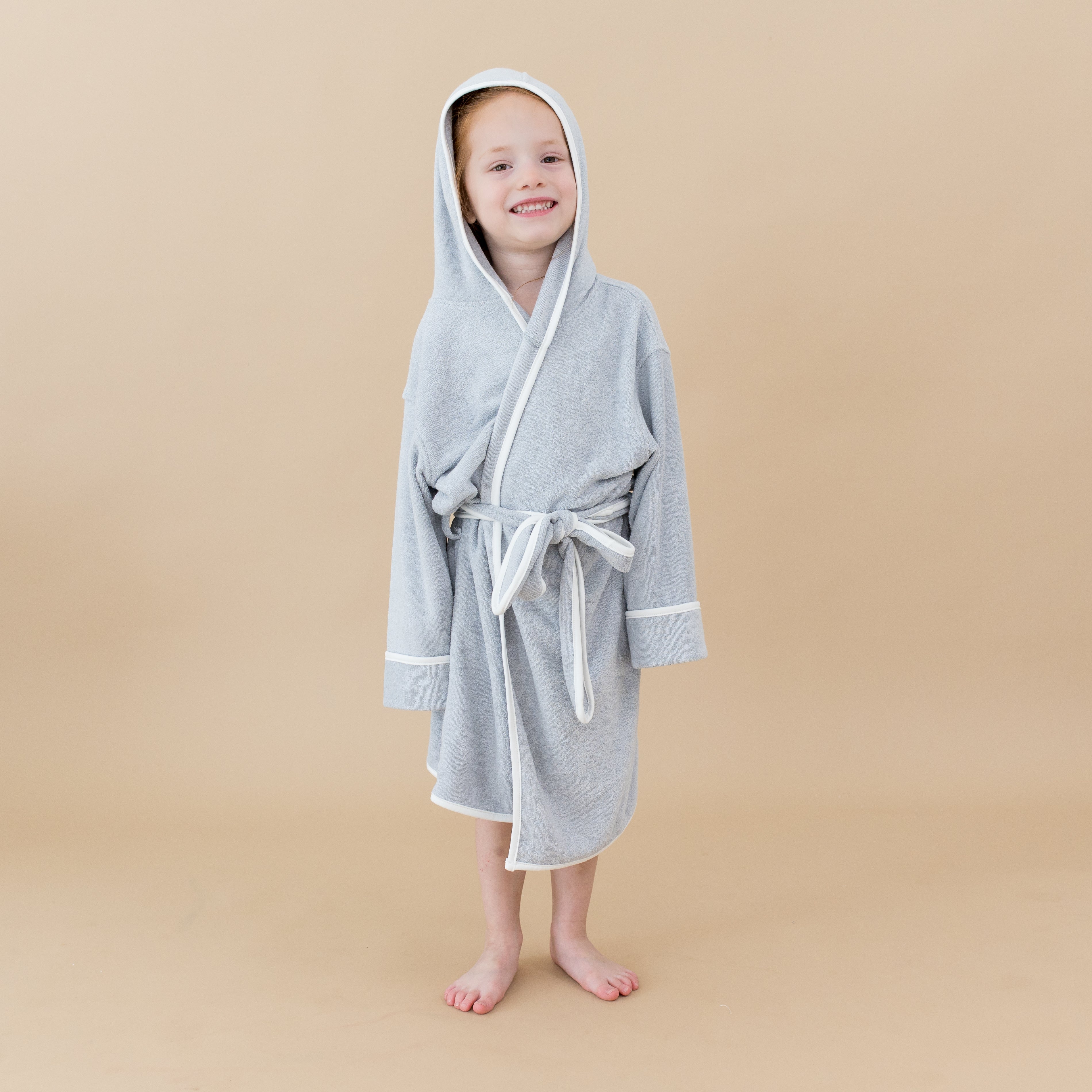 Child wearing Plush Hooded Bath Robe in Storm with Cloud Trim
