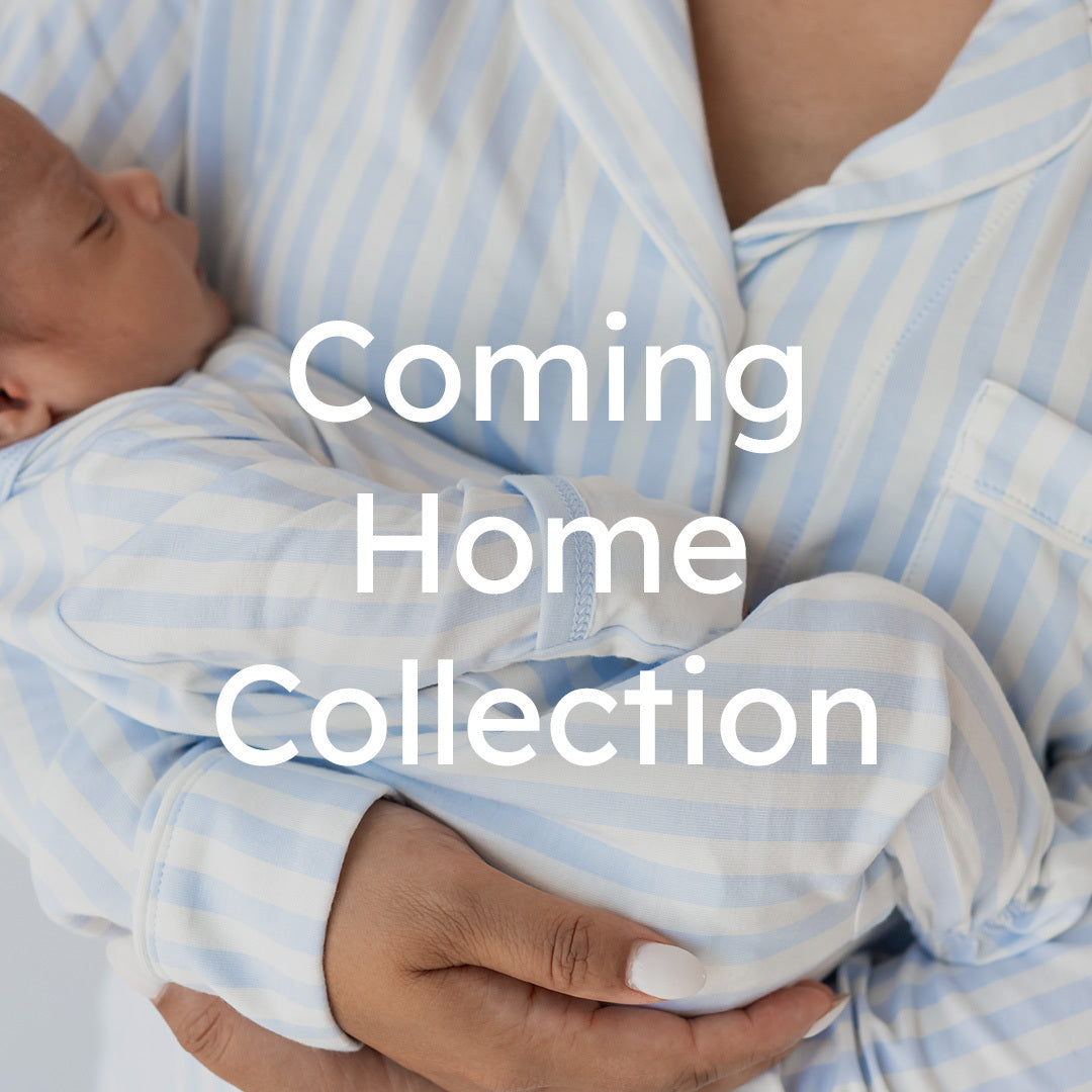 A close-up of a baby wearing a light blue and white striped onesie while being held by an adult in matching striped pajamas. Large white text across the center reads 'Coming Home Collection'.