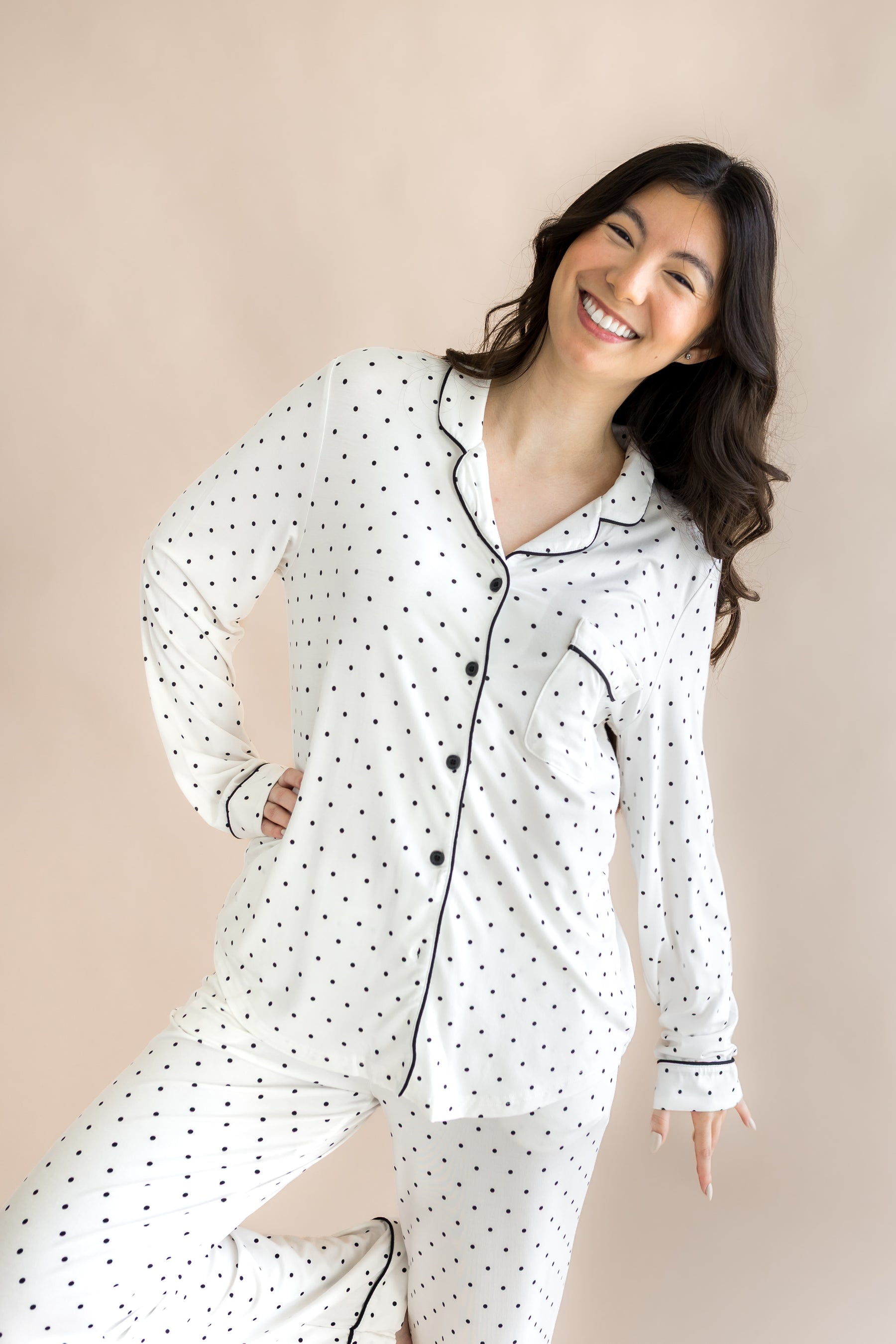 Woman modeling a long sleeve polka dot pj set