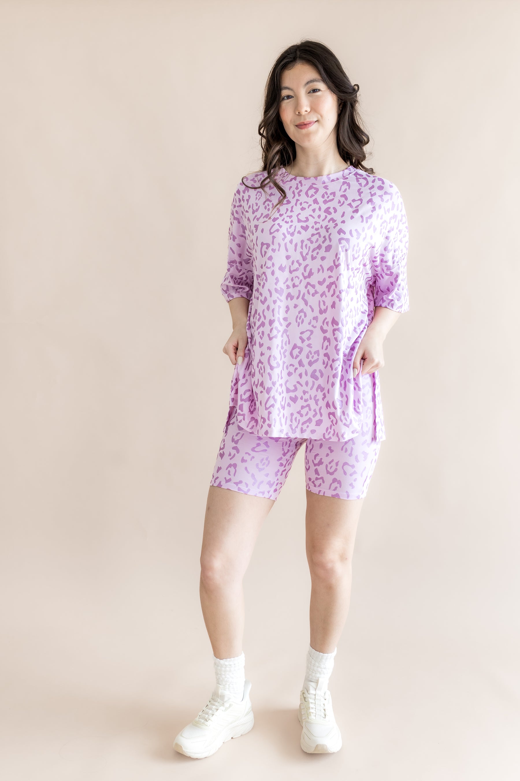 Model wearing Women’s Biker Short Set with Thistle Leopard print on a beige background