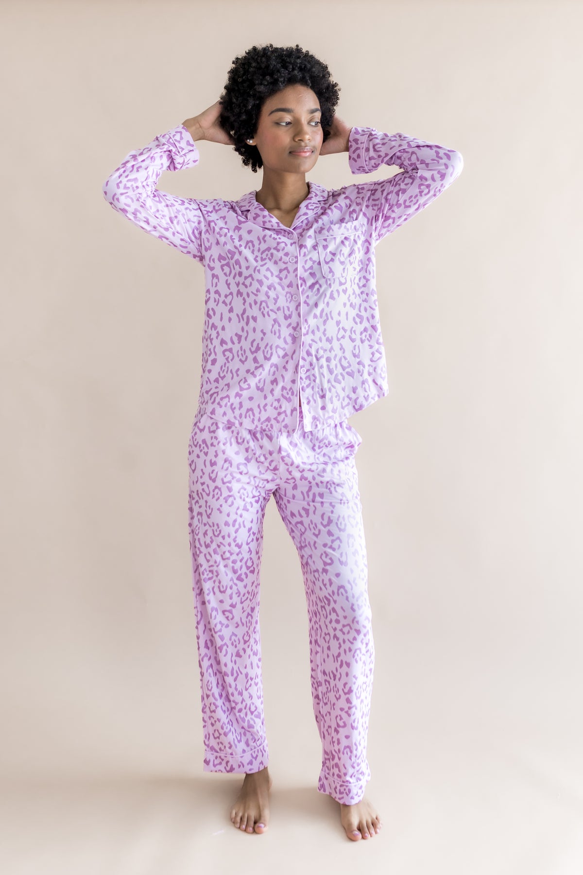 Model wearing Thistle Leopard print Women's Long Sleeve Pajama Set on a beige background
