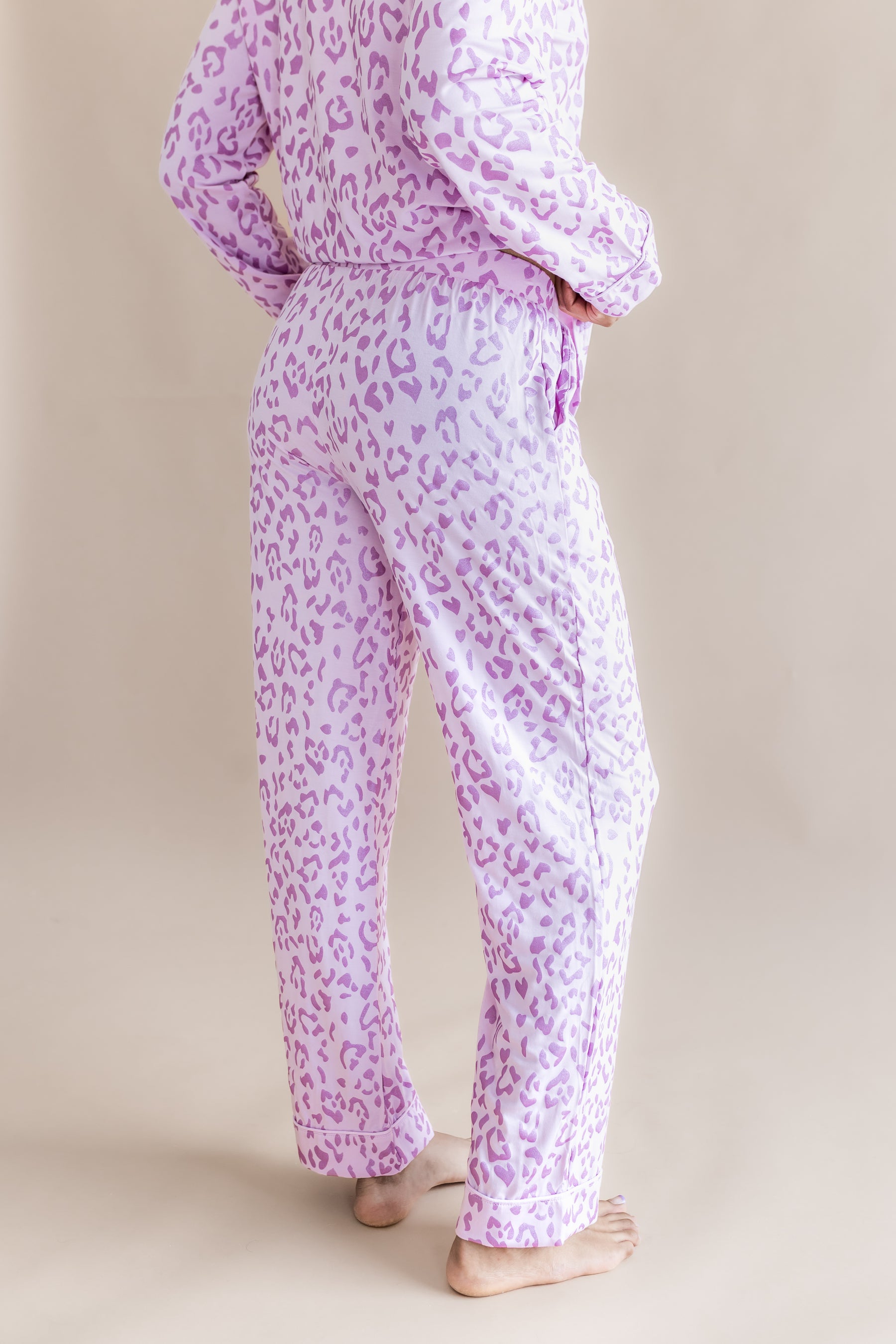Back side of Women's Long Sleeve Pajama Set in Thistle Leopard print on a beige background