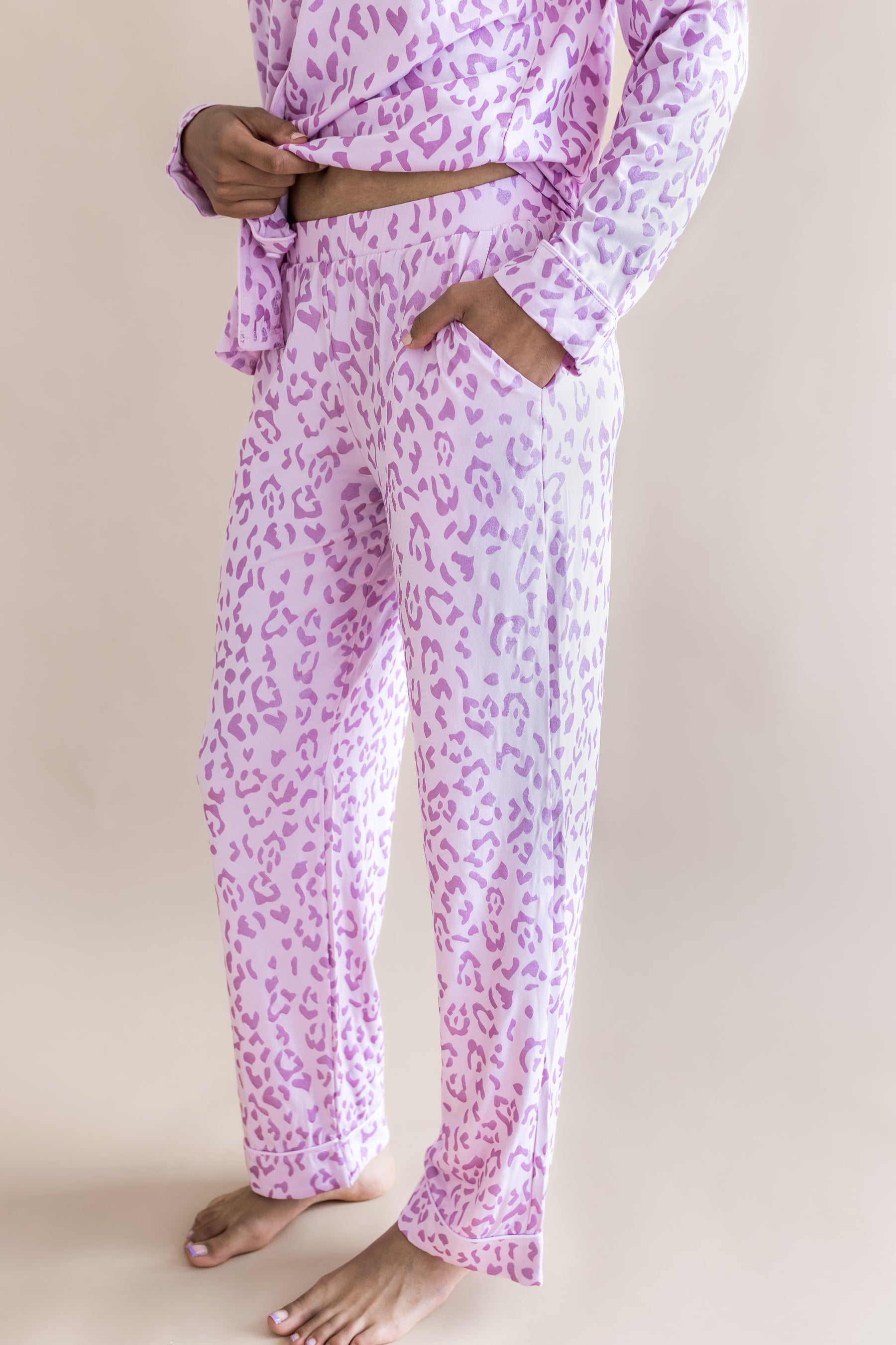Side view of Women's Long Sleeve Pajama with pockets in Thistle Leopard print on a beige background