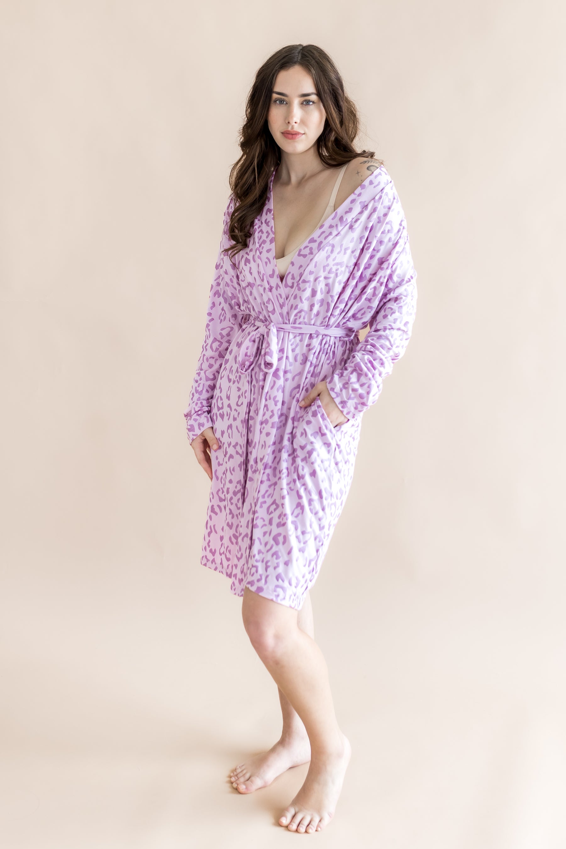 Model posing in Women's lounge robe in Thistle Leopard print on a beige background