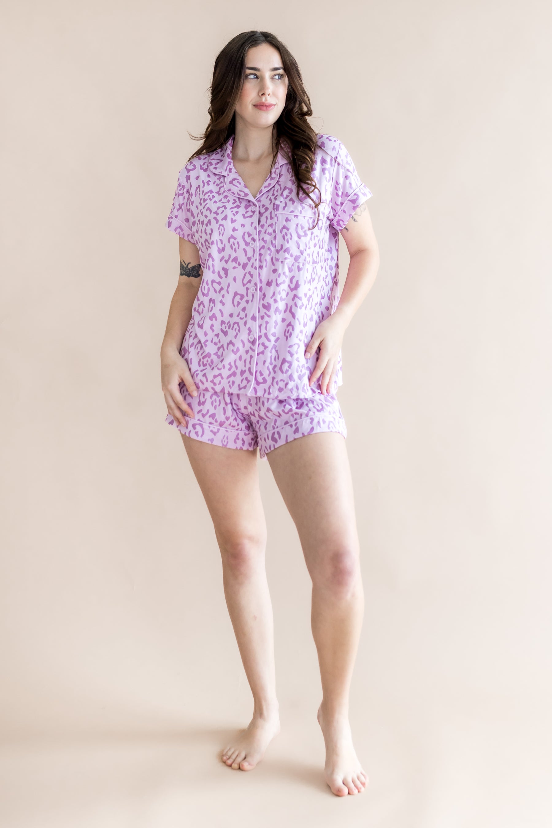 Model posing in Women's Short sleeve pajama set with Thistle Leopard print on a beige background
