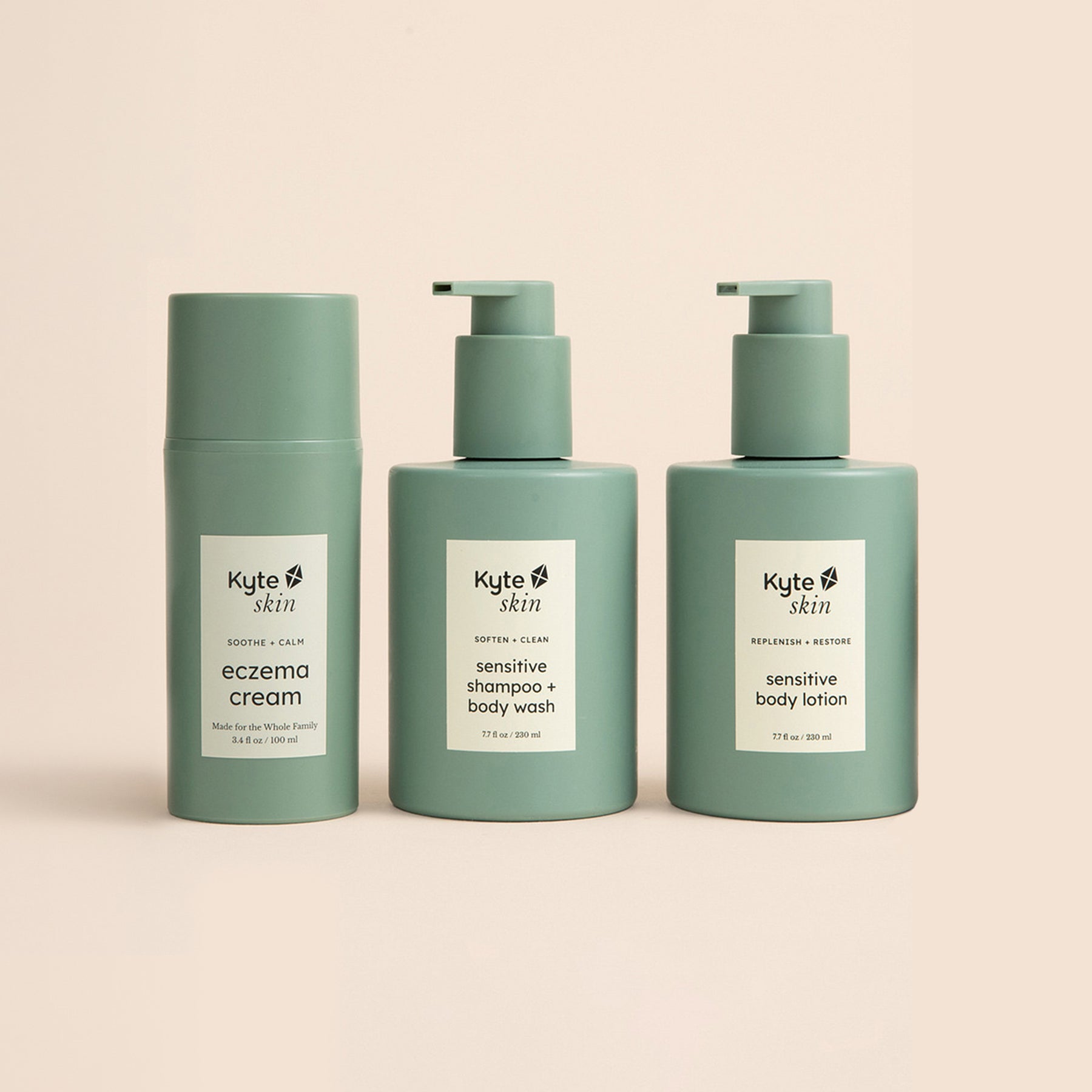 Three green bottles of Kyte Skin products on a beige background