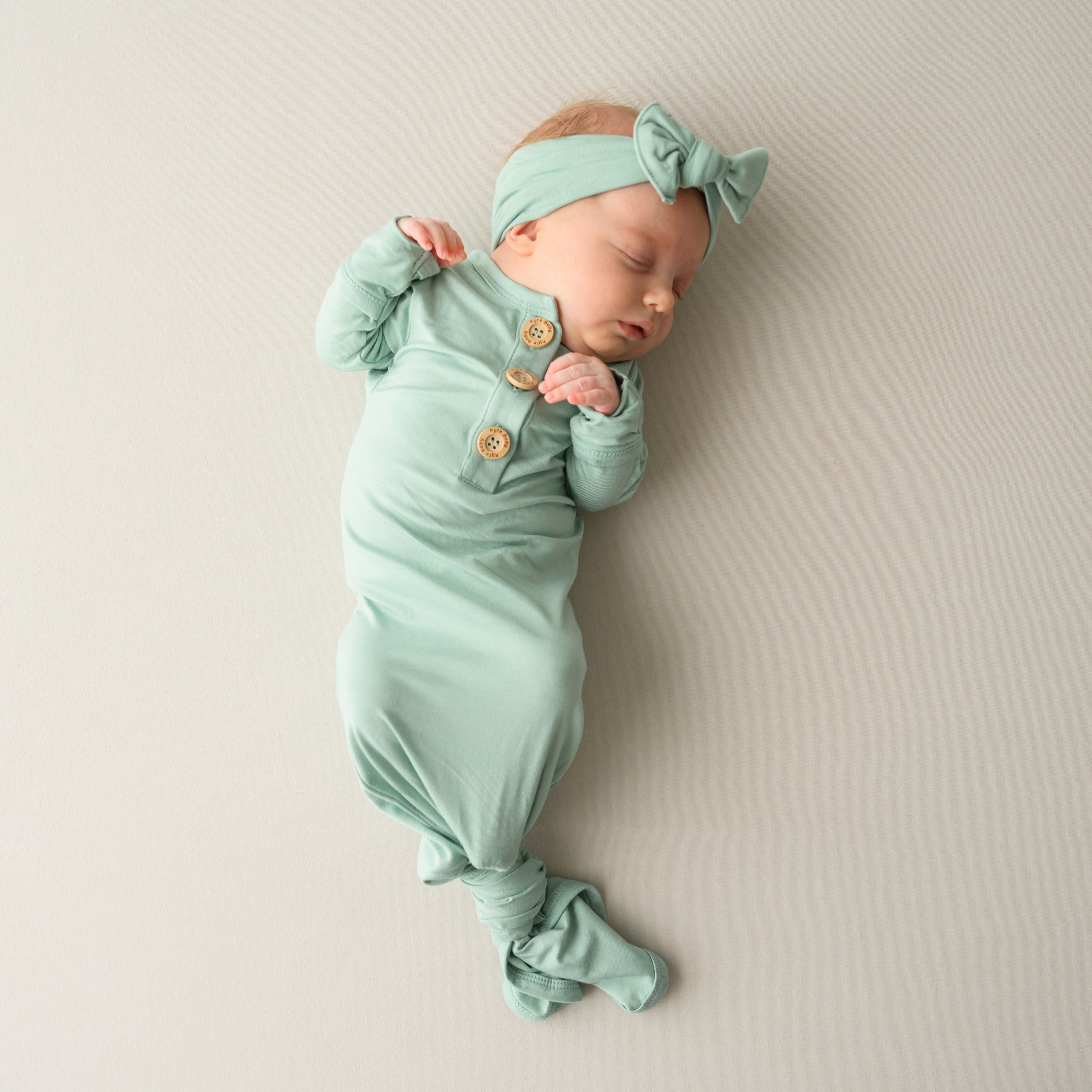 Knotted Gown with Bow Set in Sage  on sleeping baby