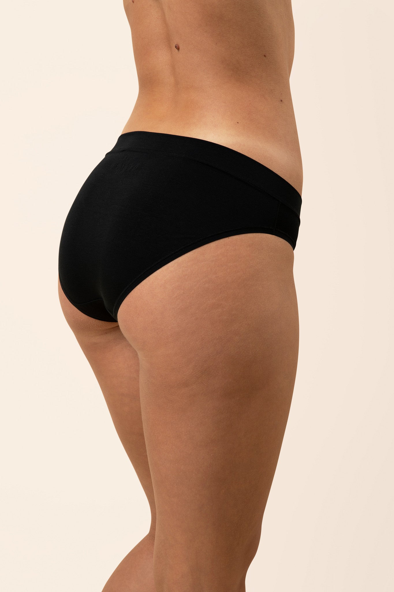 Woman wearing a midi brief with full coverage 