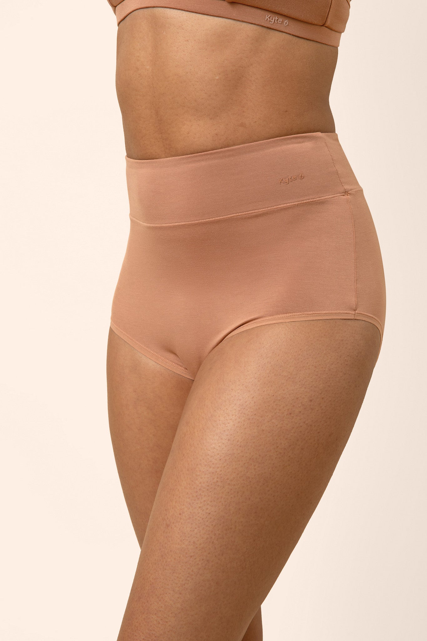 Women's High-Waisted Brief in Latte shown on a model