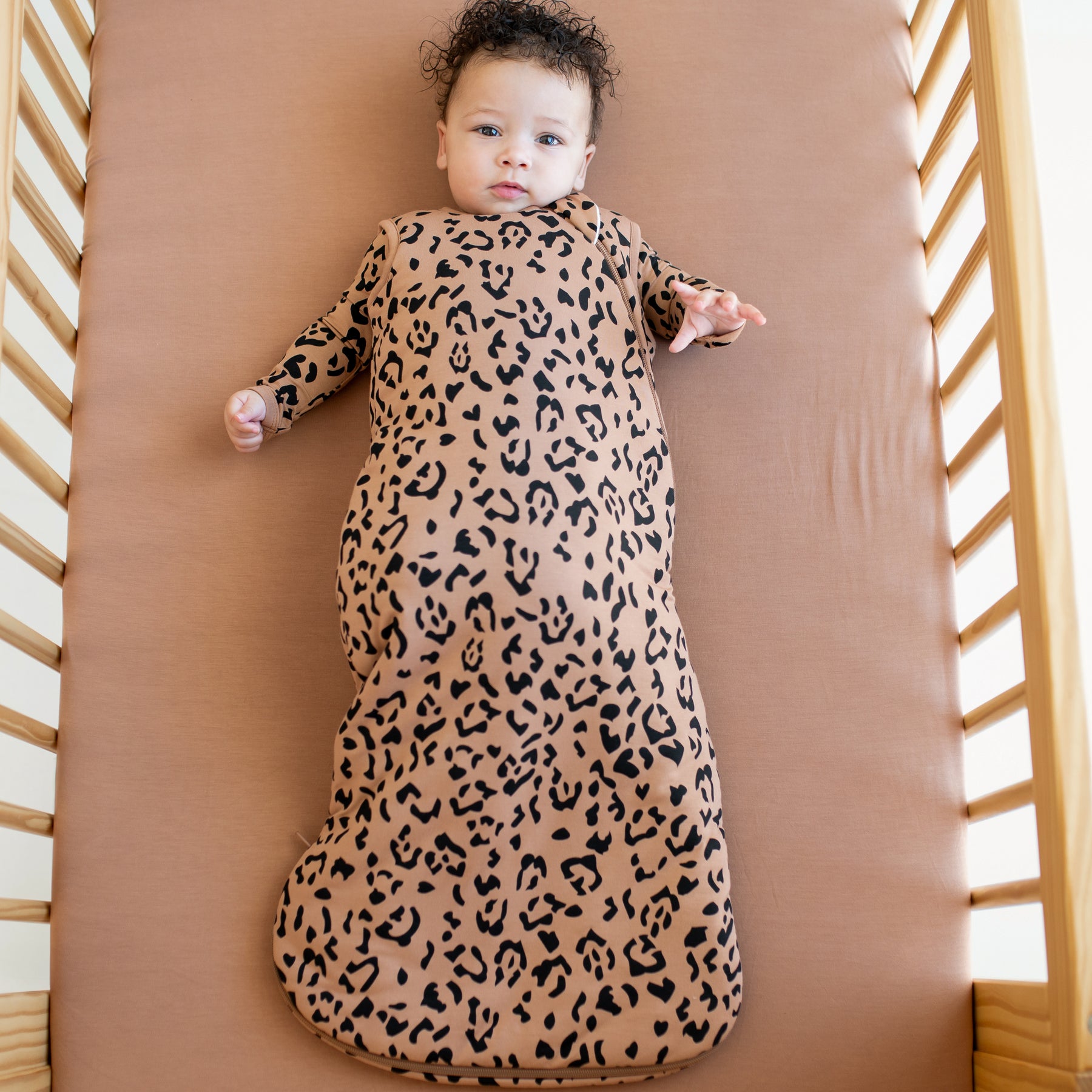Baby wearing bamboo Sleep Bag in Latte Leopard 2.5 TOG with long sleeve leopard pajamas