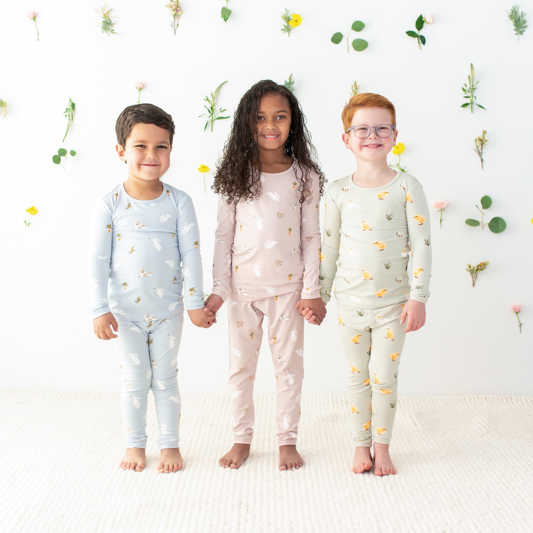 3 toddlers wearing kyte baby easter prints