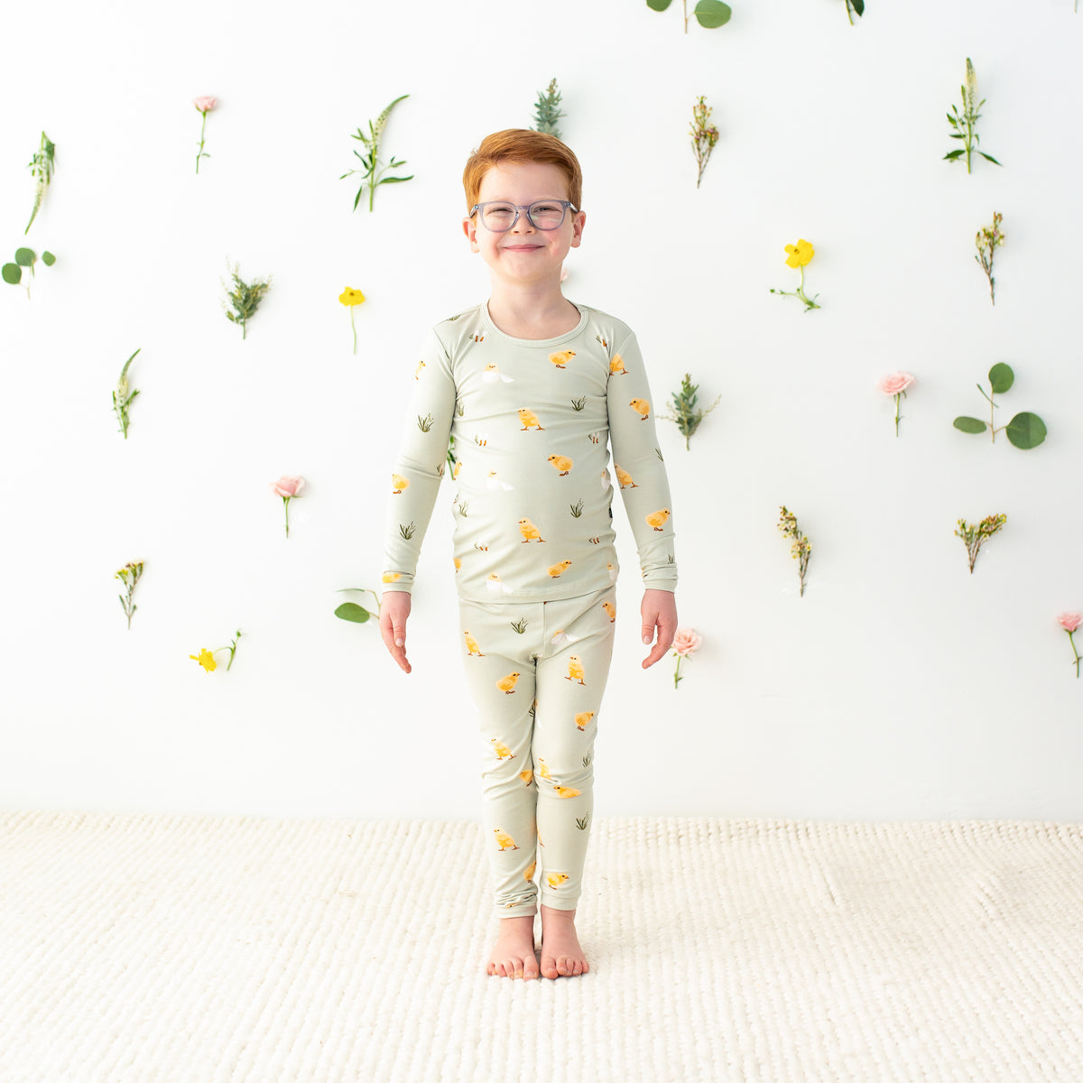 Toddler wearing Long Sleeve Pajamas in Aloe Chick