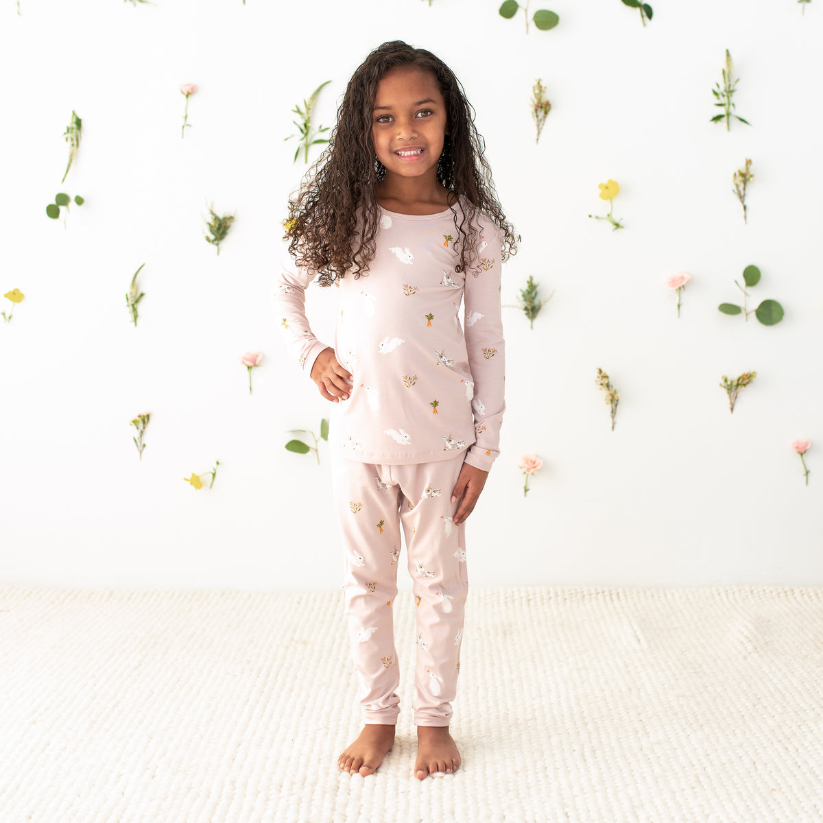 Toddler modeling Long Sleeve Pajamas in Blush Rabbit